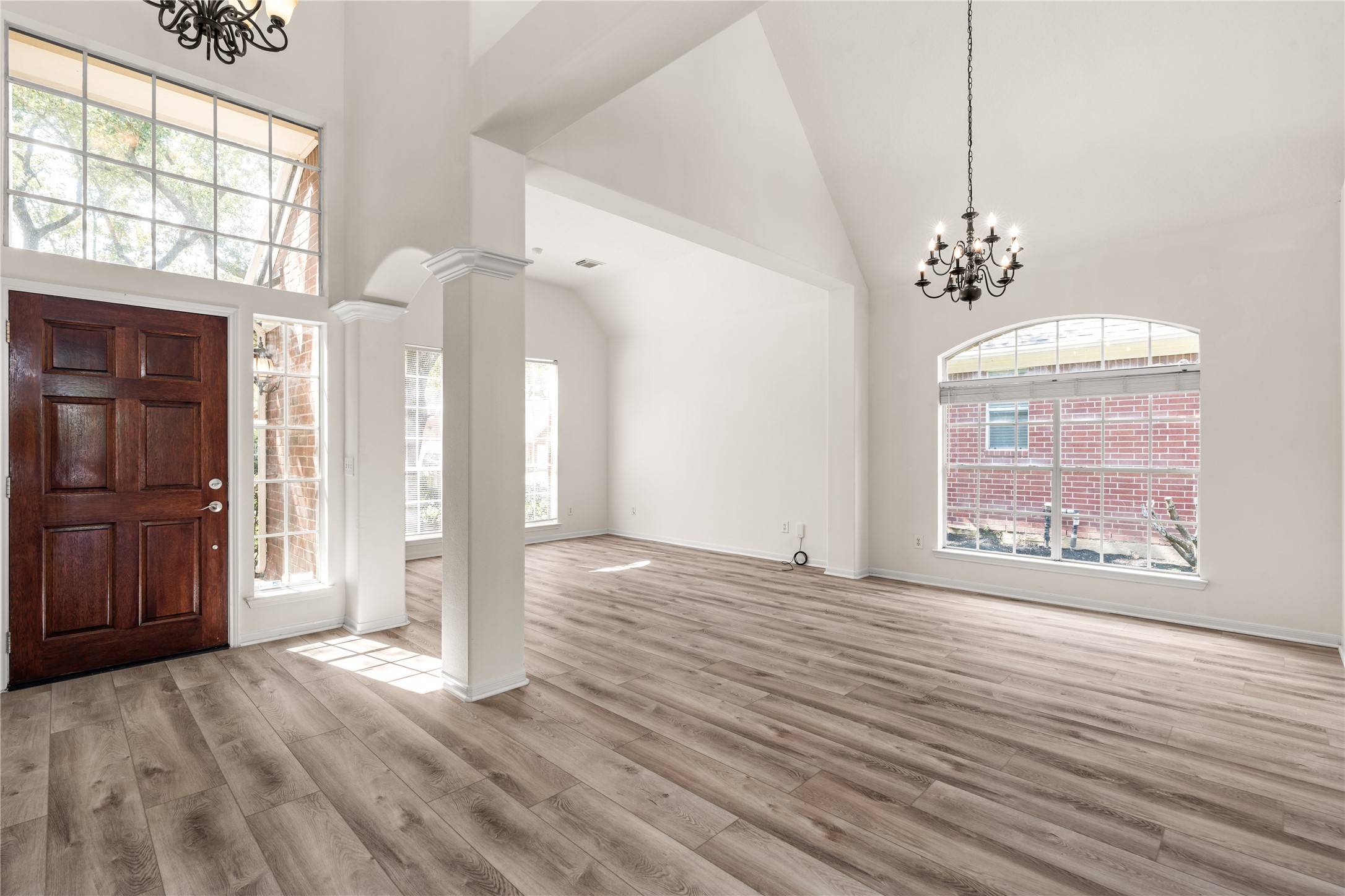 Beautiful entry way including light fixtures, high ceilings, & natural light galore.