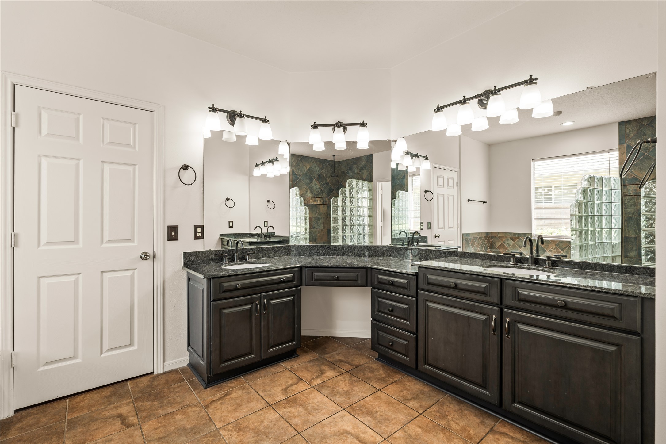 En suite bathroom featuring dual sinks & vanity