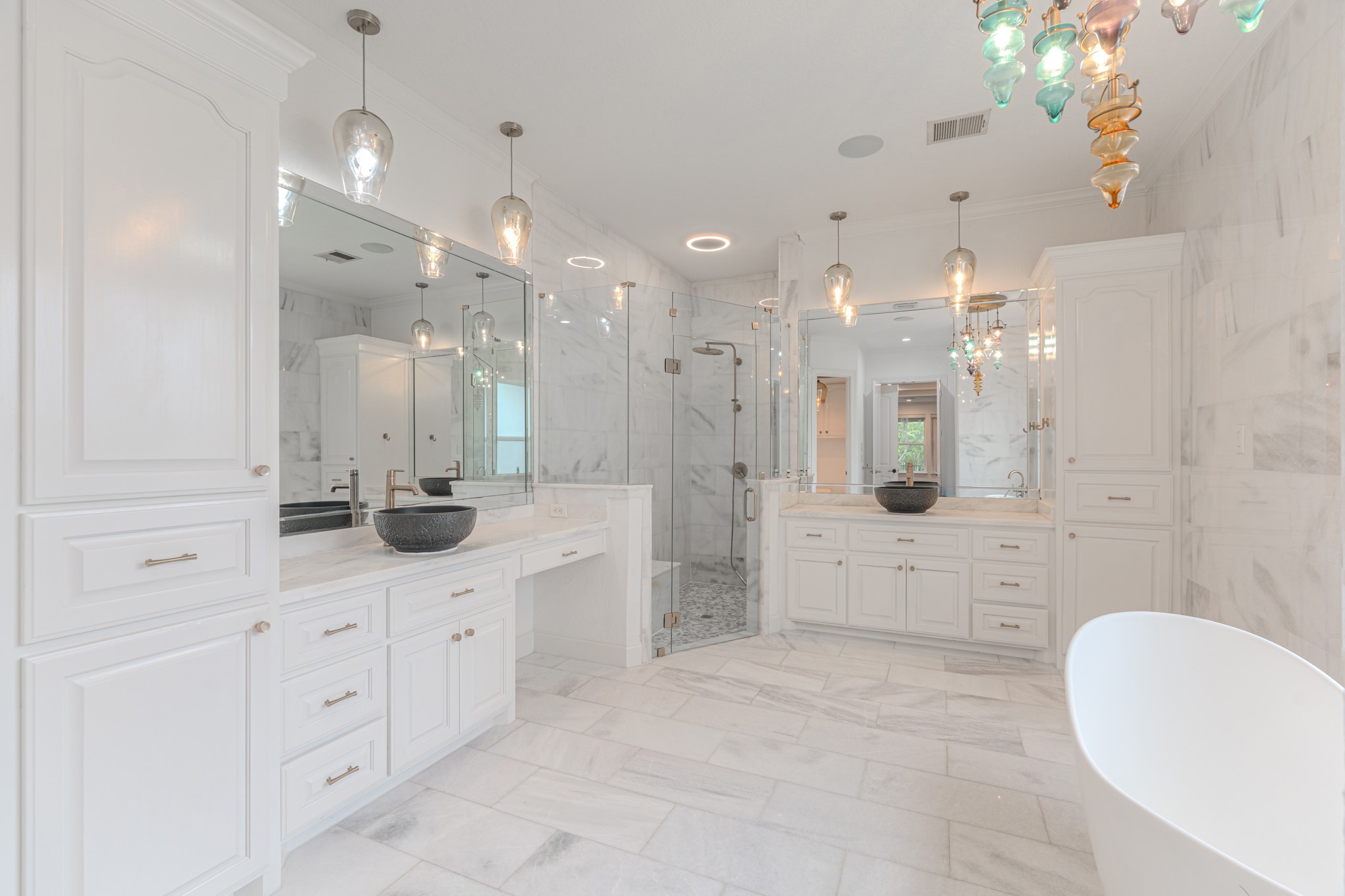 Every detail in this bathroom is perfection from the marble to the oversized walk in shower.