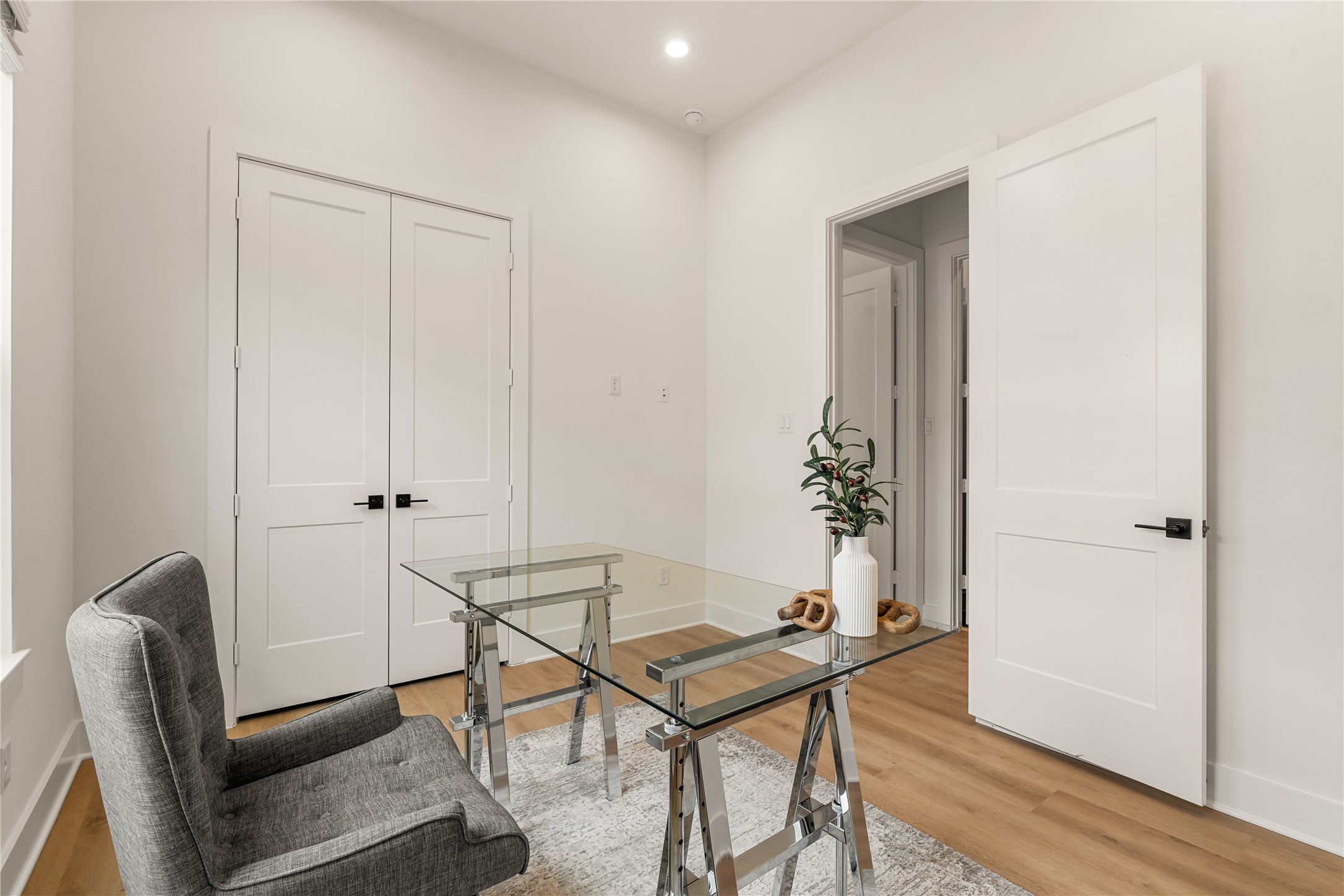Versatile flex room complete with generous closet storage and natural lighting.