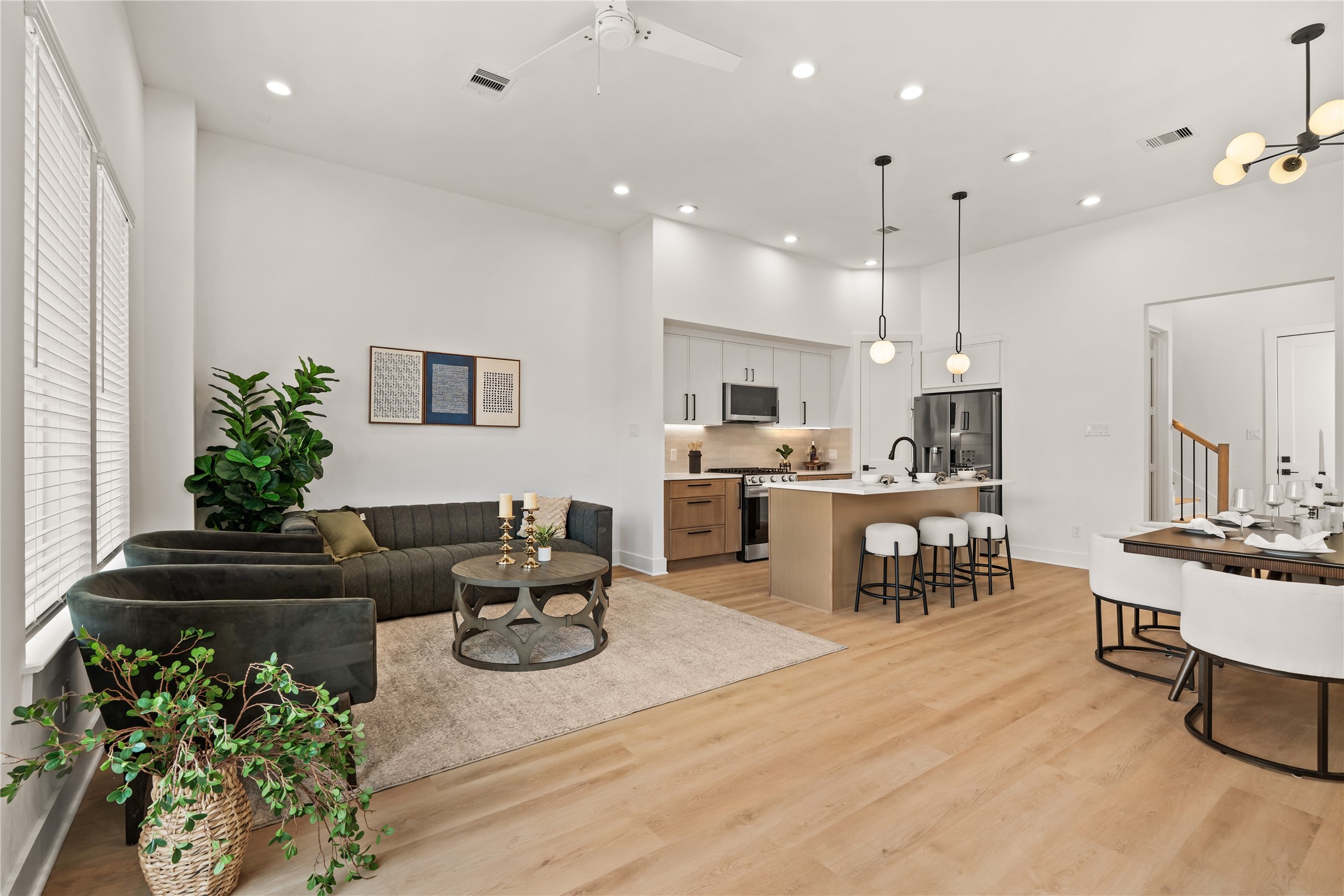 Expansive main-floor layout connecting the living, dining, and kitchen spaces for effortless hosting.