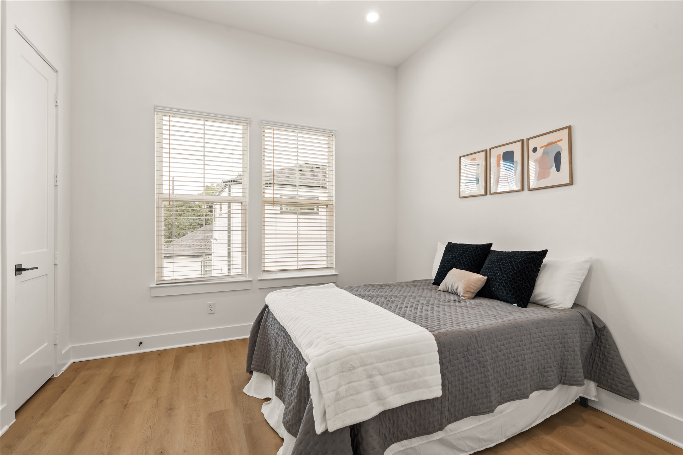 Spacious secondary bedroom offering a quiet, comfortable retreat for family or guests.
