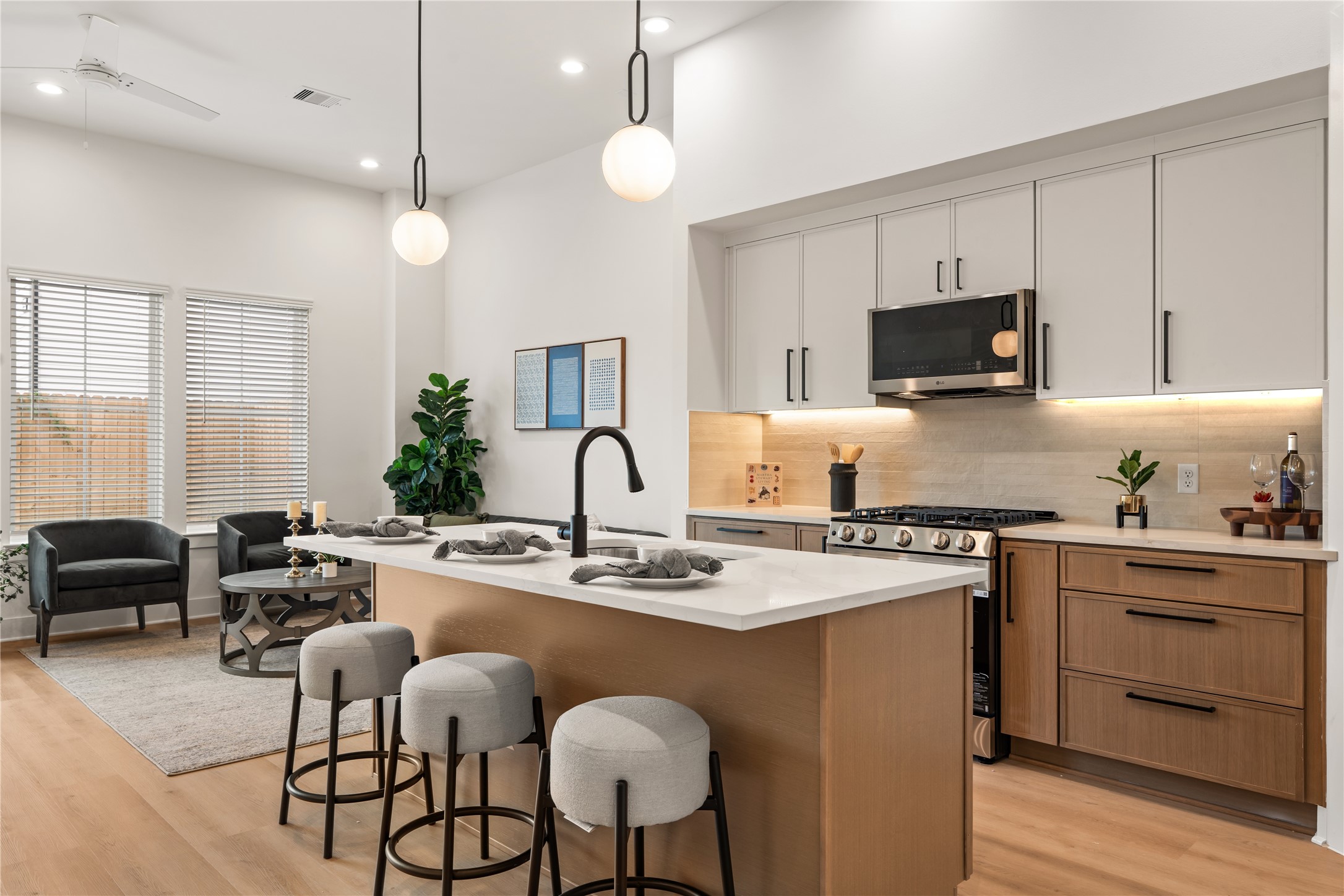 Modern kitchen workflow featuring soft-close cabinetry, a gas range, and task lighting.
