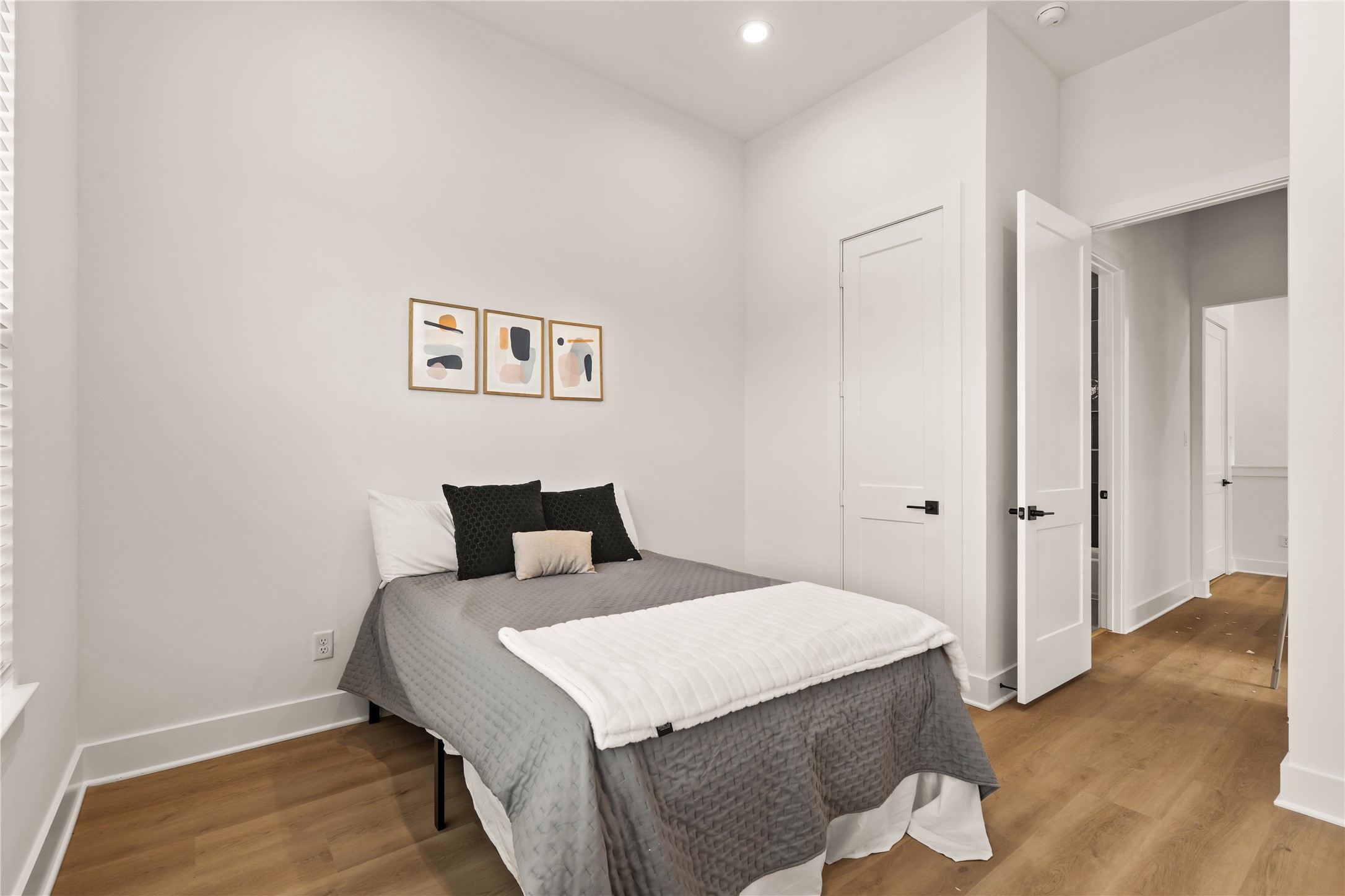 Restful guest bedroom layout providing quiet privacy and generous closet space.
