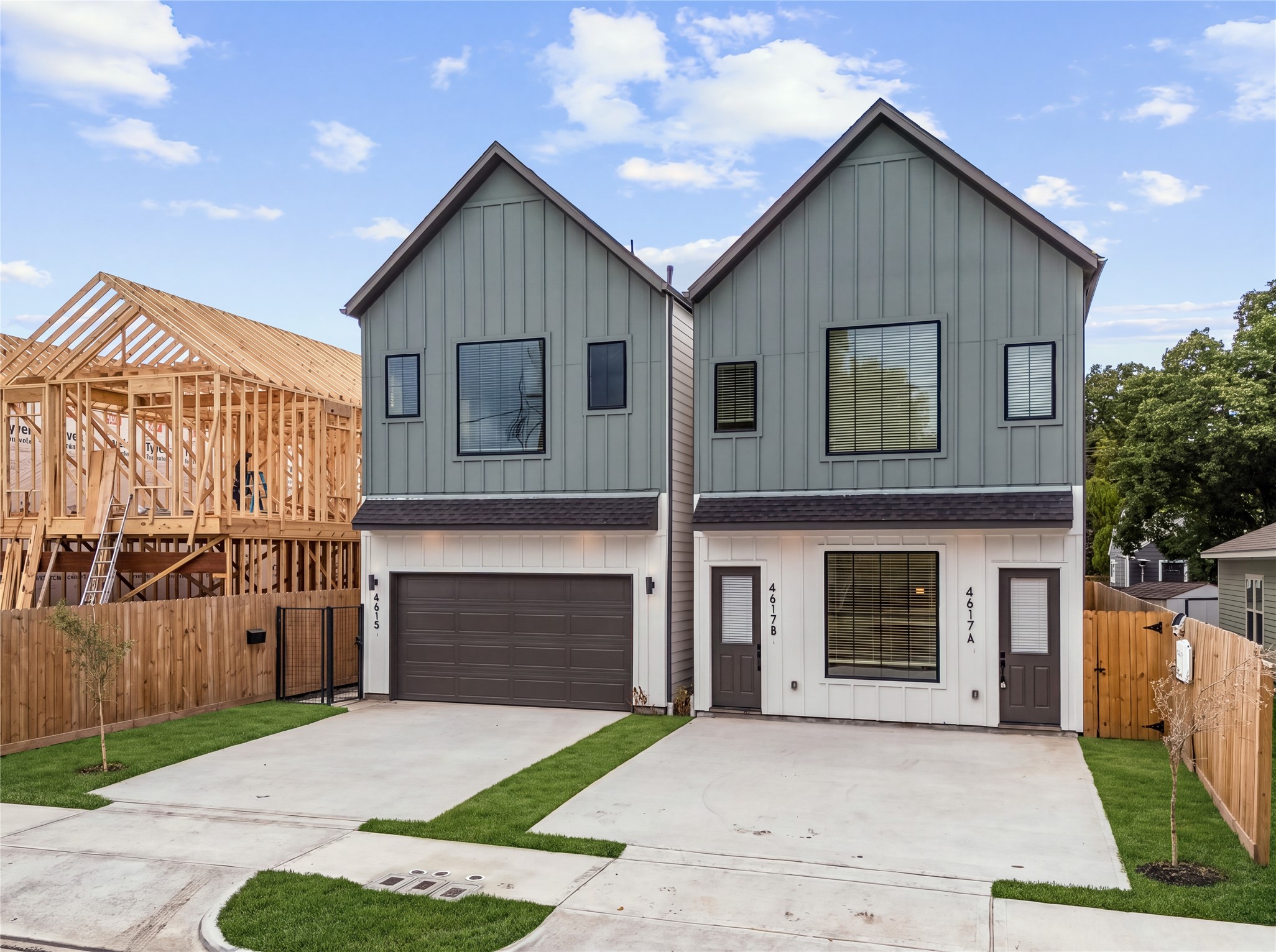 Fresh architectural design combining low-maintenance siding with a private gated entry.