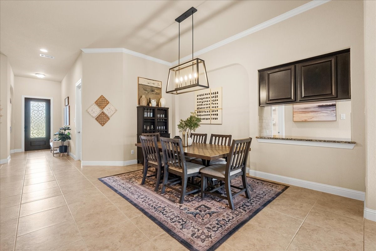The formal dining area is conveniently located just off the living room and kitchen, creating a seamless flow thats perfect for both everyday living and entertaining.