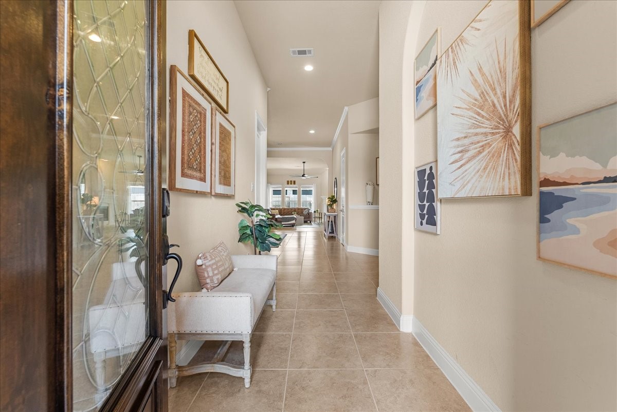 Enter to soaring ceilings, graceful arched entries, and abundance of  natural light creating an impressive welcome.