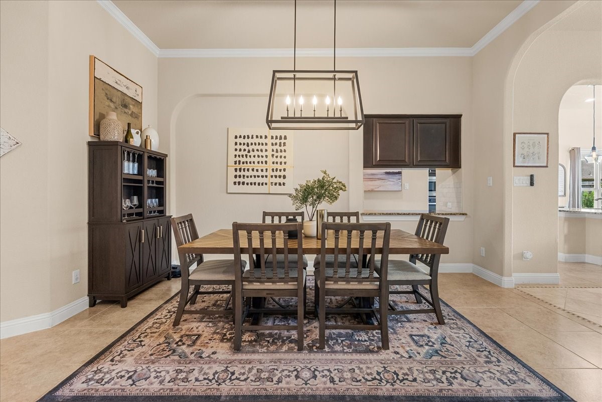 The formal dining area is conveniently located just off the living room and kitchen, creating a seamless flow thats perfect for both everyday living and entertaining.