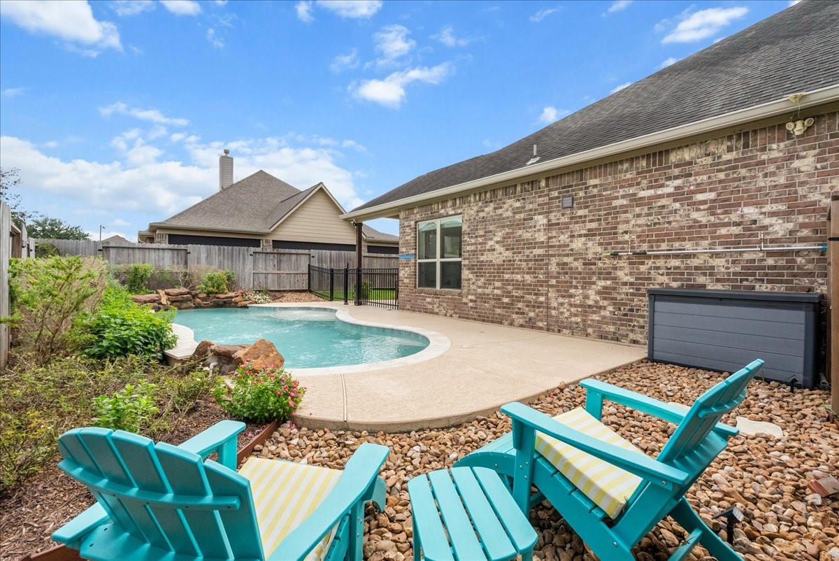 Step outside to your private backyard oasis featuring a sparkling pool, extended patio perfect for entertaining, and plenty of additional yard space for the kids to play.