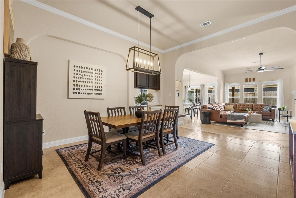The formal dining area is conveniently located just off the living room and kitchen, creating a seamless flow thats perfect for both everyday living and entertaining.