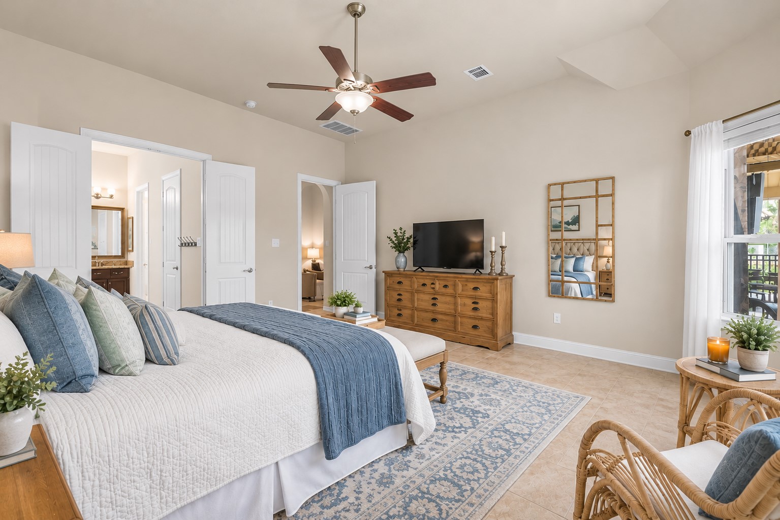 The spacious primary bedroom offers a peaceful retreat complete with a private en-suite bath.
