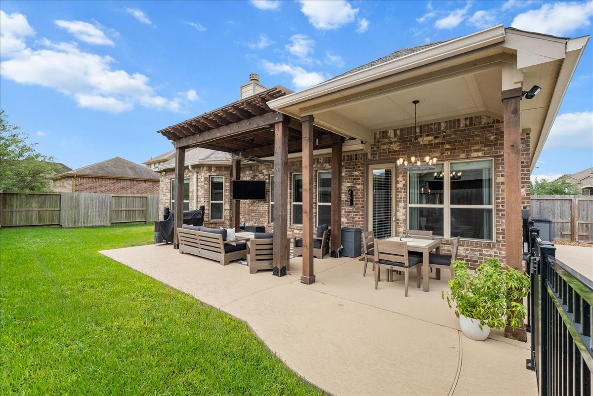 Step outside to your private backyard oasis featuring a sparkling pool, extended patio perfect for entertaining, and plenty of additional yard space for the kids to play.