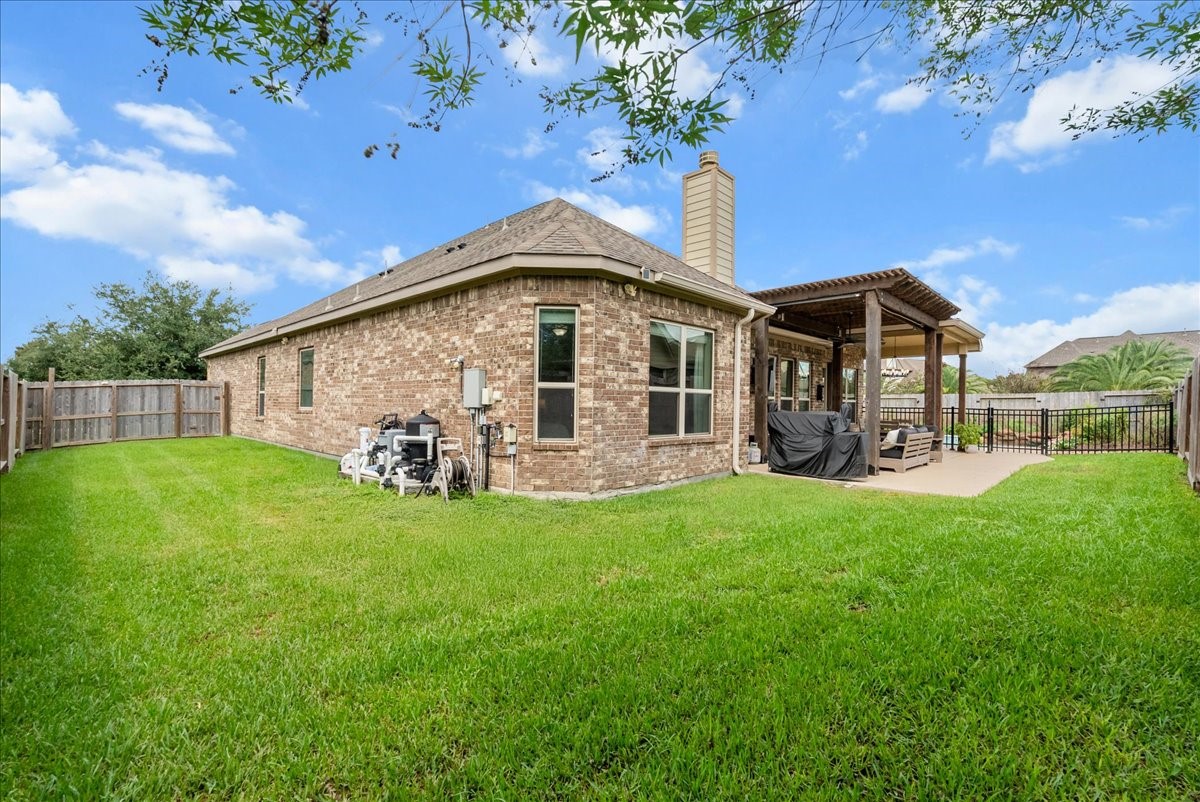 Step outside to your private backyard oasis featuring a sparkling pool, extended patio perfect for entertaining, and plenty of additional yard space for the kids to play.