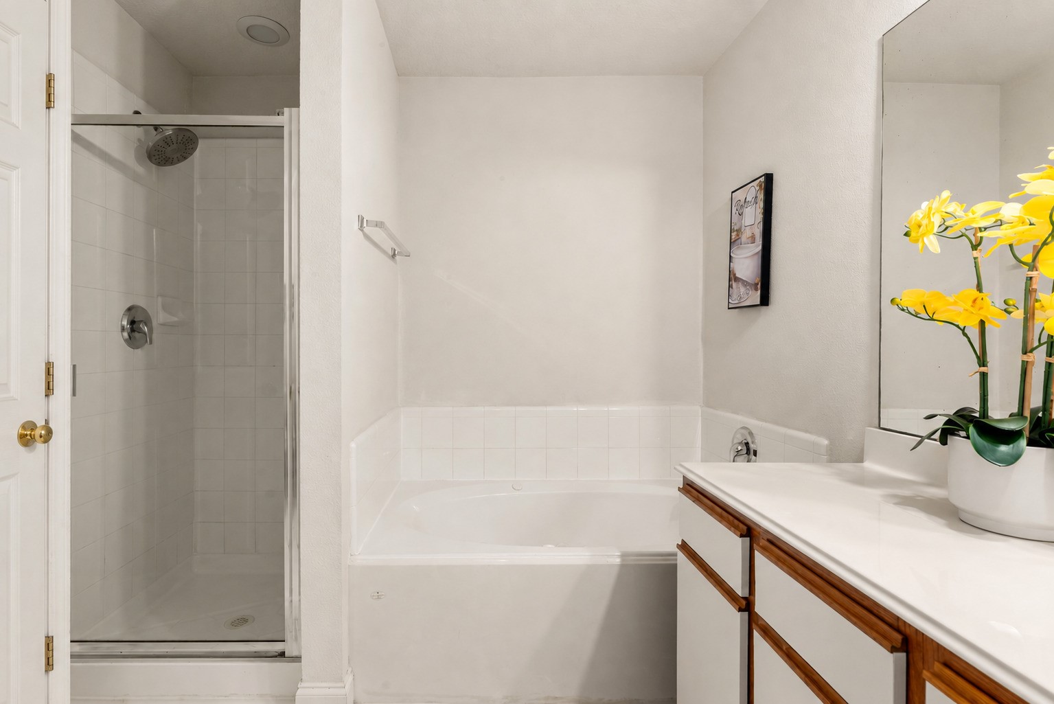 Primary bath offers a separate shower and soaking tub.