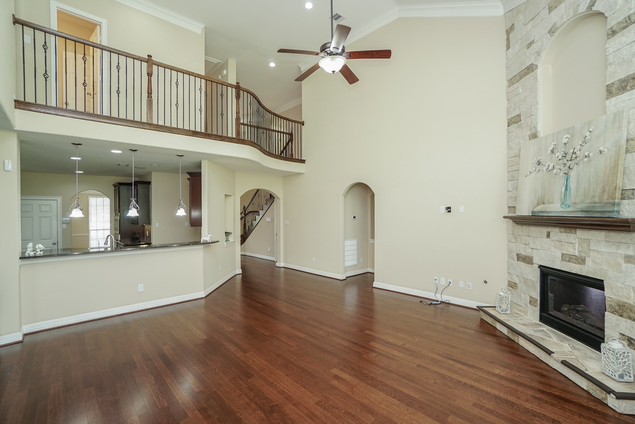 Another view of this gorgeous space!! Neutral palette, crown molding, hard wood floors, and open floor plan are sure to please. Another view of this gorgeous space!! Neutral palette, crown molding, hard wood floors, and open floor plan are sure to please.