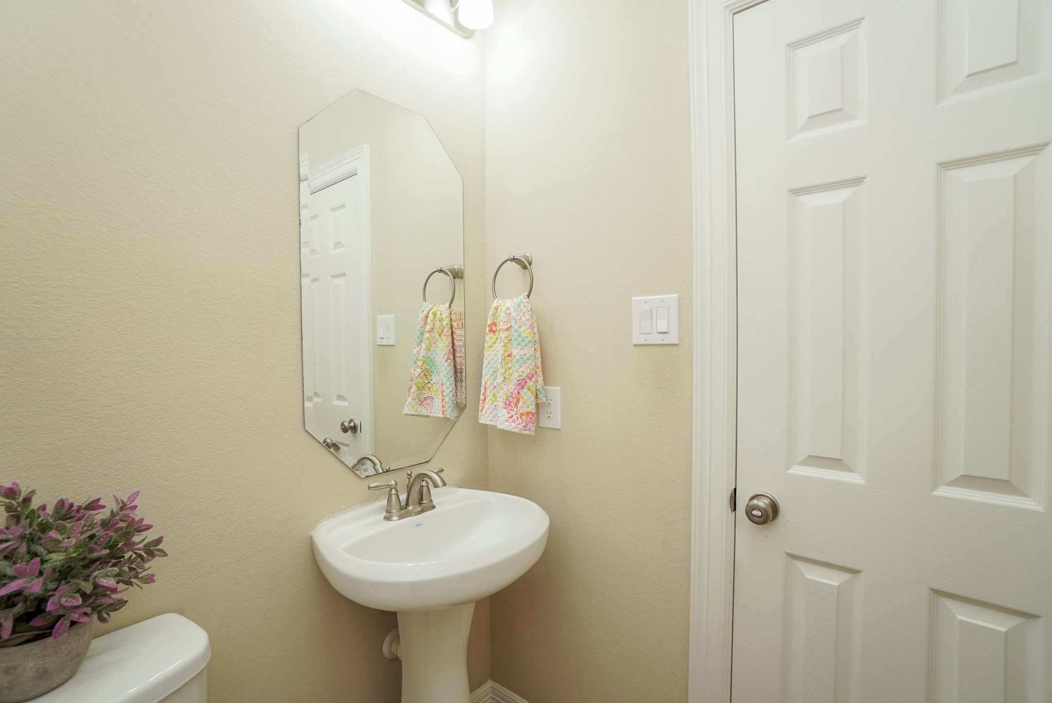 This half bath is located by the front door. This half bath is located by the front door.