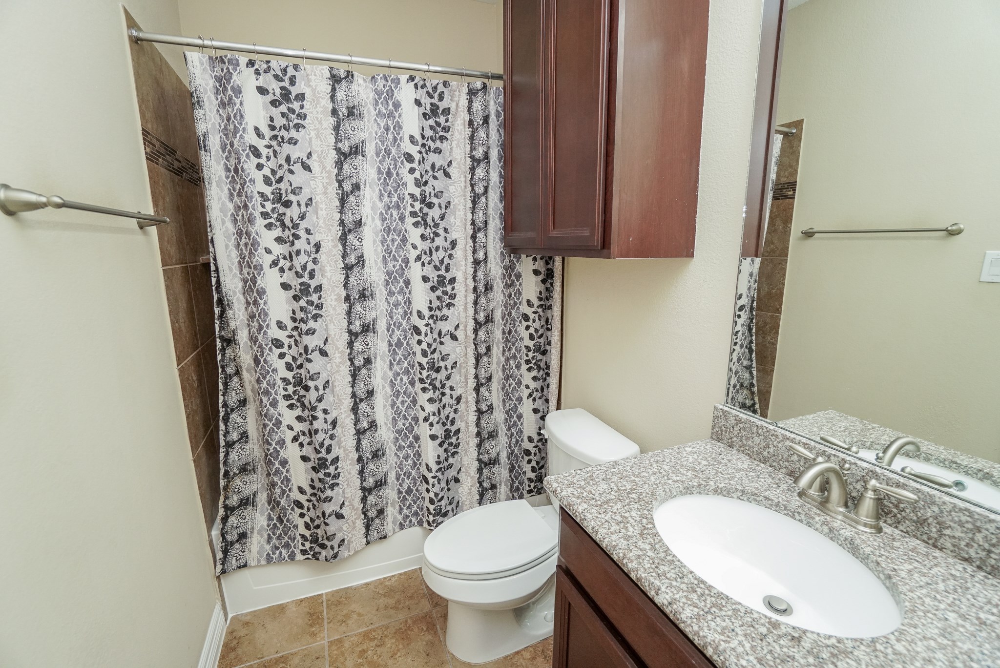 Full bath downstairs off of second Bedroom on main floor.