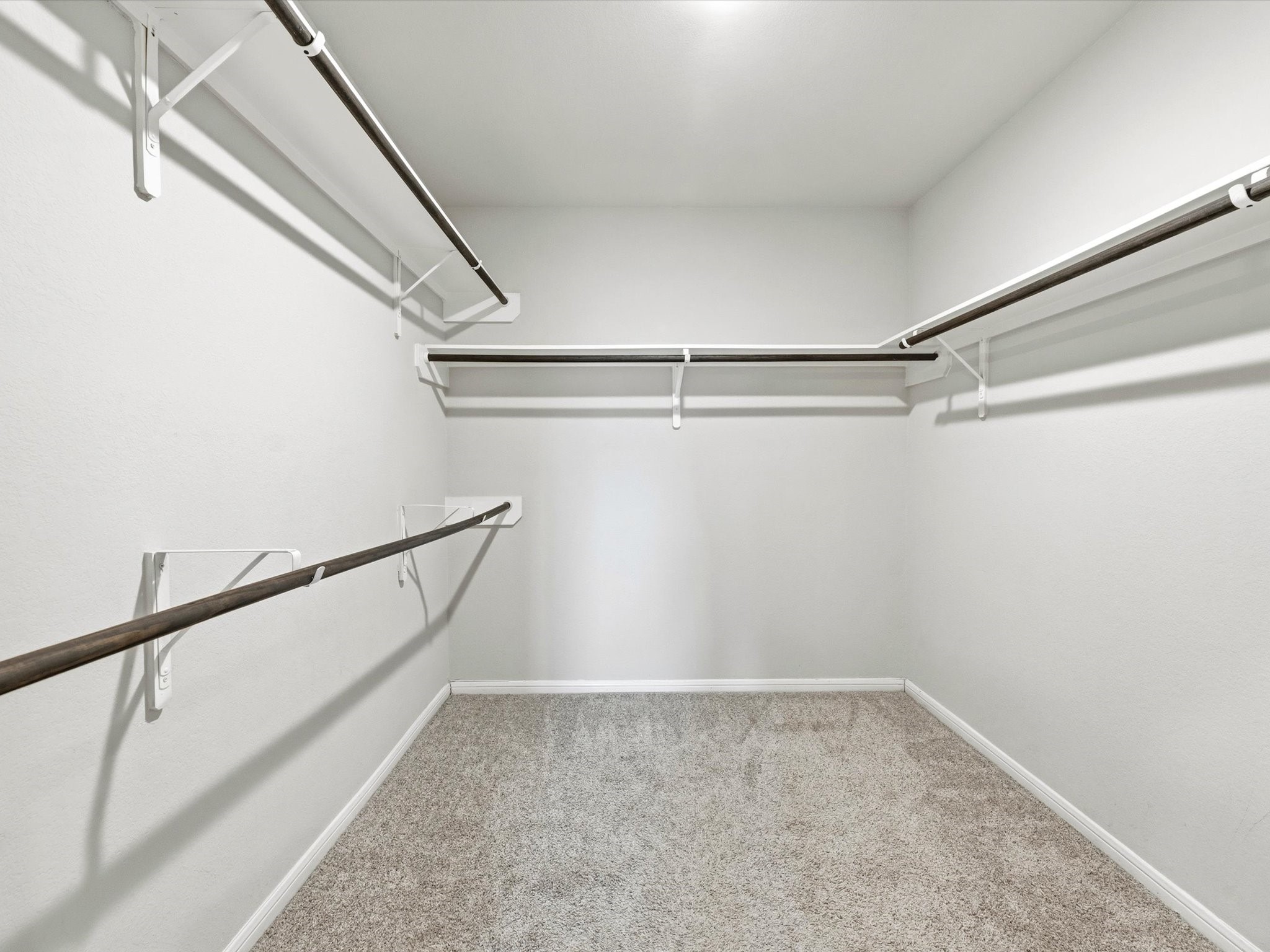 Primary closet offers space for all your clothes!