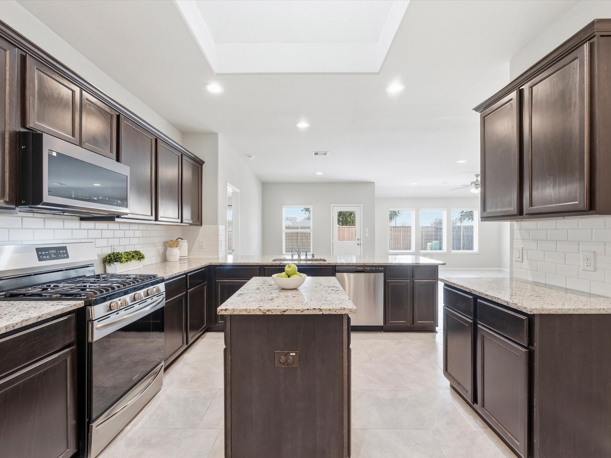 Tons of cabinets and counters. Skylight illuminates your prep island!