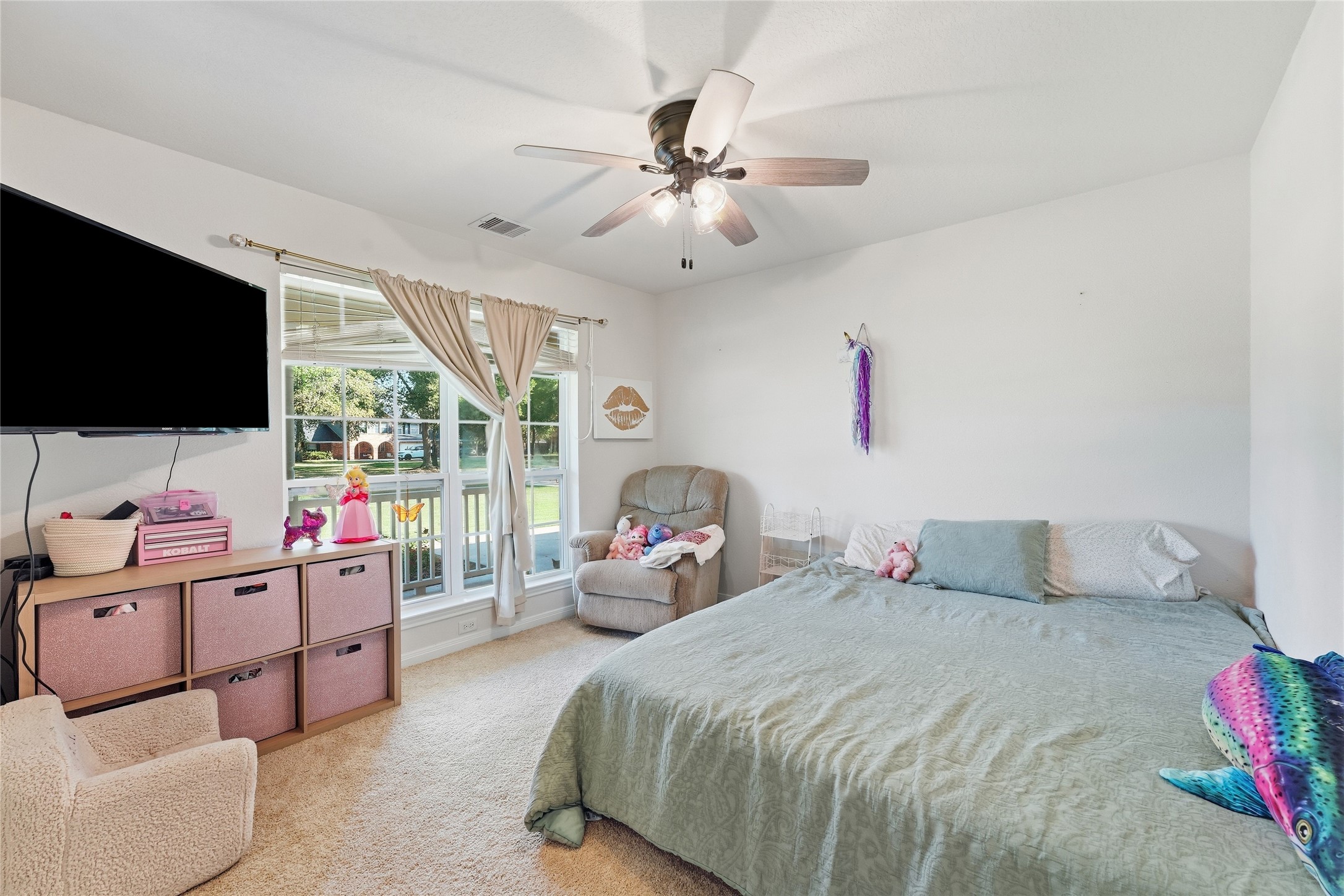 This secondary bedroom offers plenty of natural light and new carpet.
