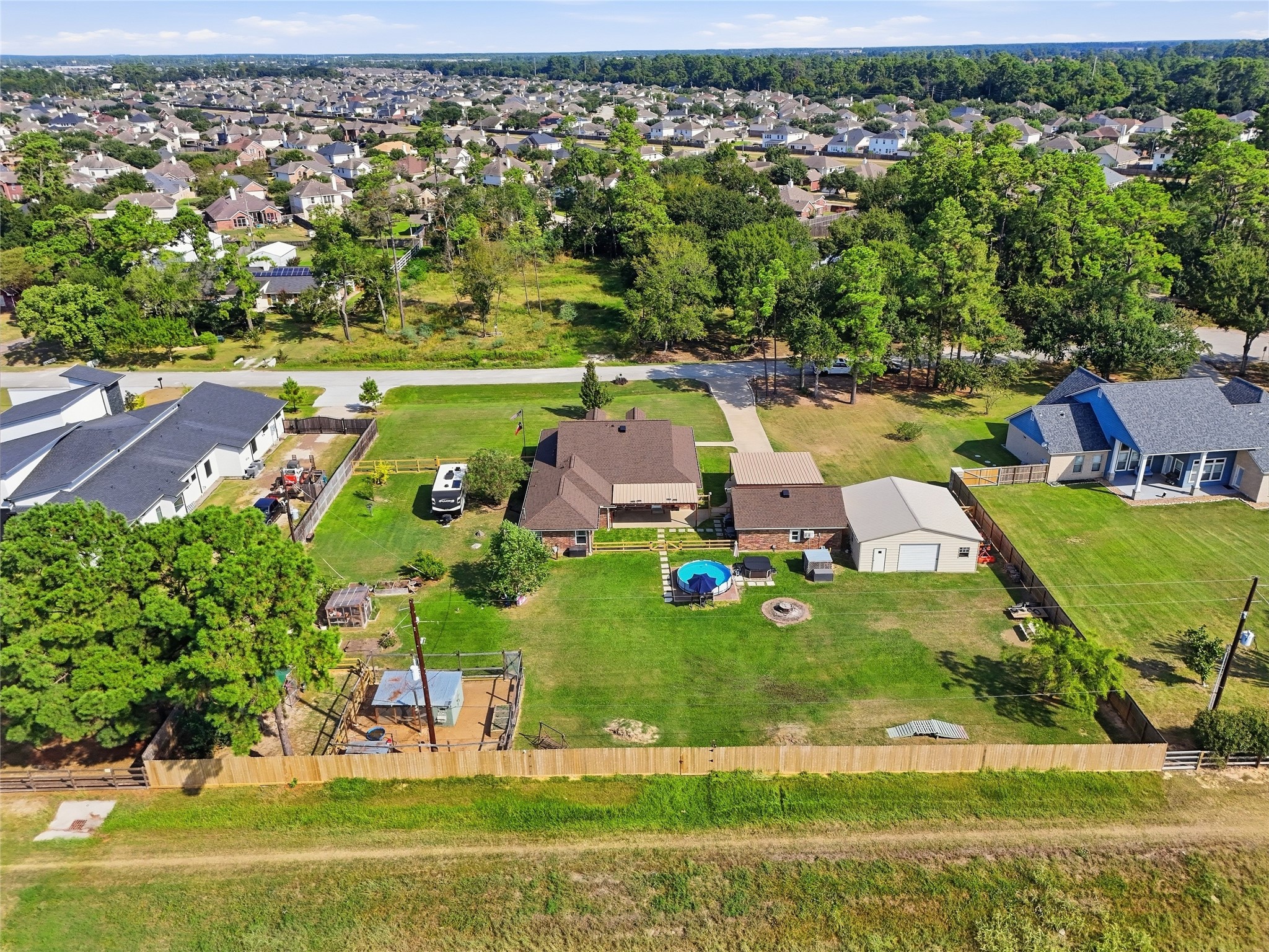 Rear view of the property showcasing the jogging and biking path just beyond the backyard, with no rear neighbors.