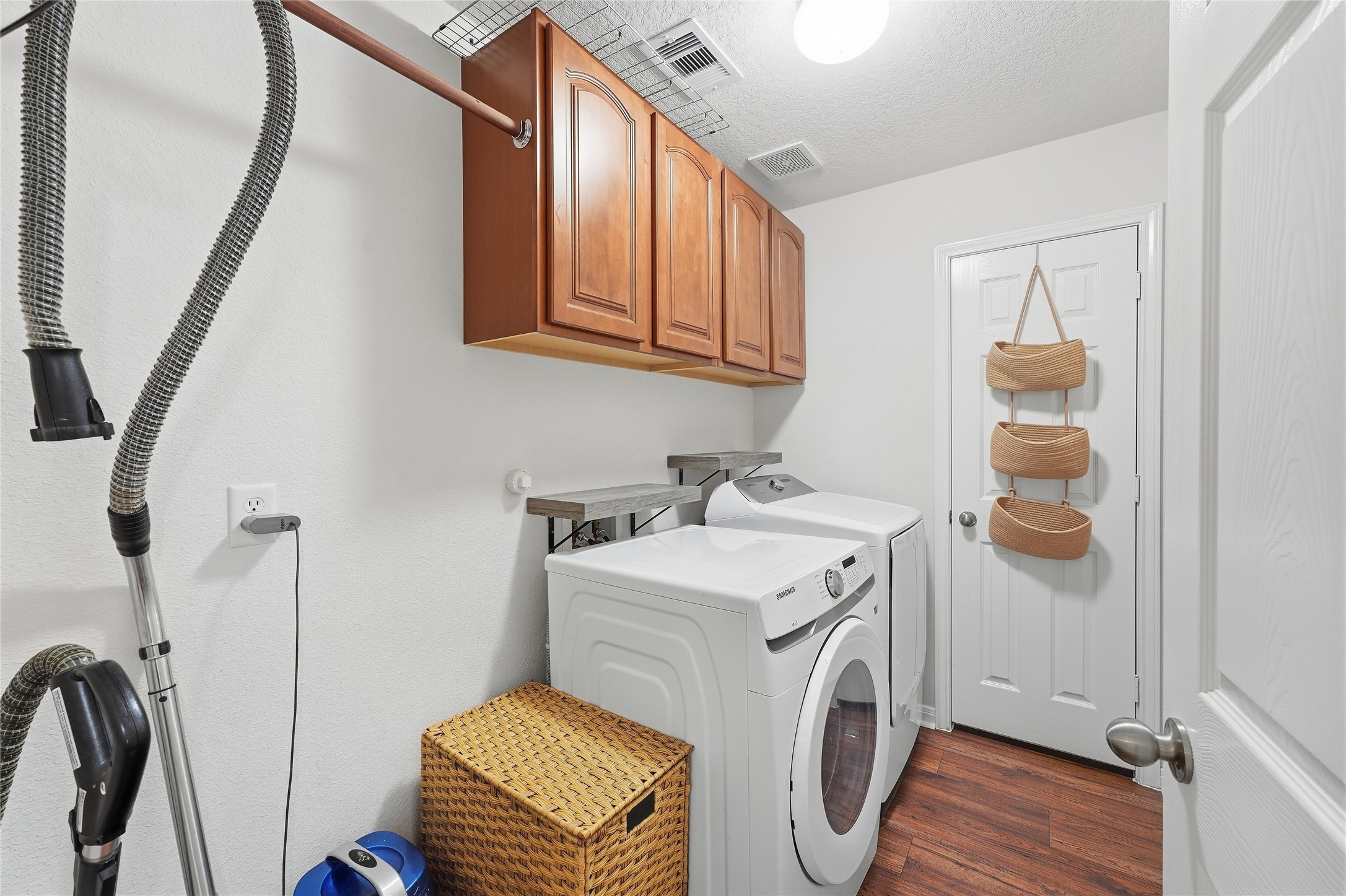 Large laundry room with plenty of storage.