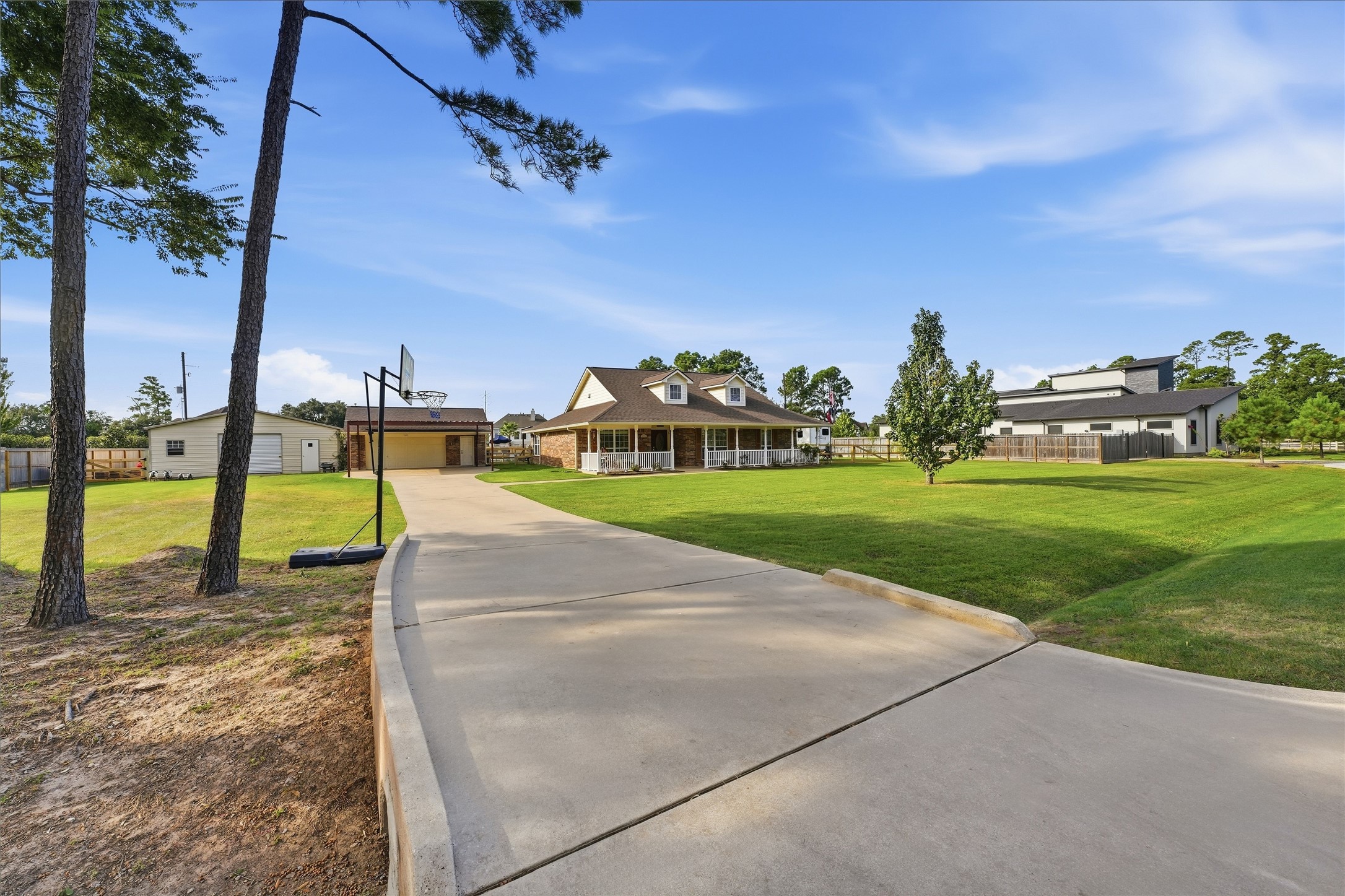 A long driveway welcomes you home with extra room for guest parkingmaking it easy to host gatherings and enjoy your acre of space. A long driveway welcomes you home with extra room for guest parkingmaking it easy to host gatherings and enjoy your acre of space.