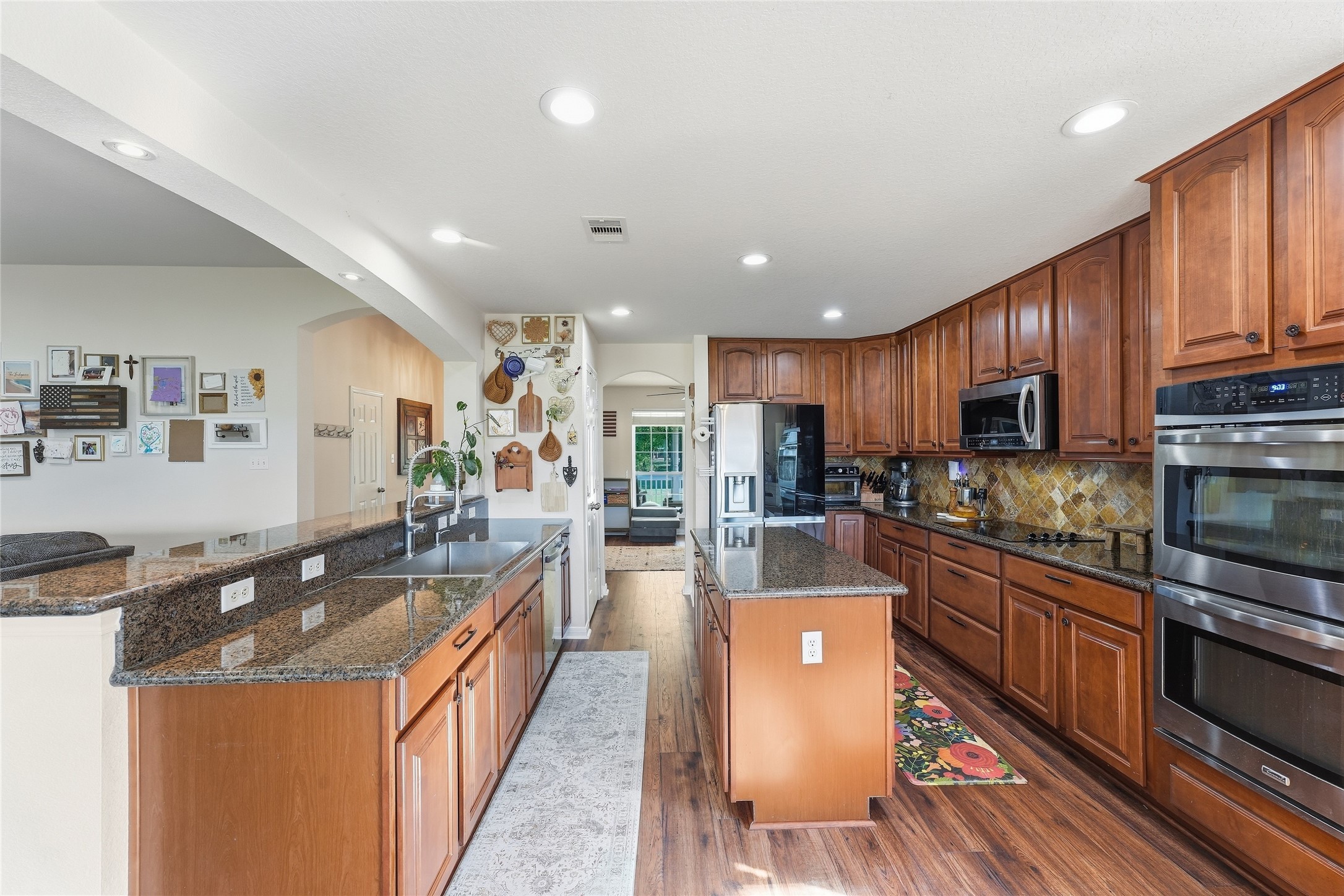 This recently updated kitchen offers generous cabinet space, a practical layout, granite countertops, a stainless-steel sink and coordinating stainless-steel appliancesready for everyday meals and entertaining.