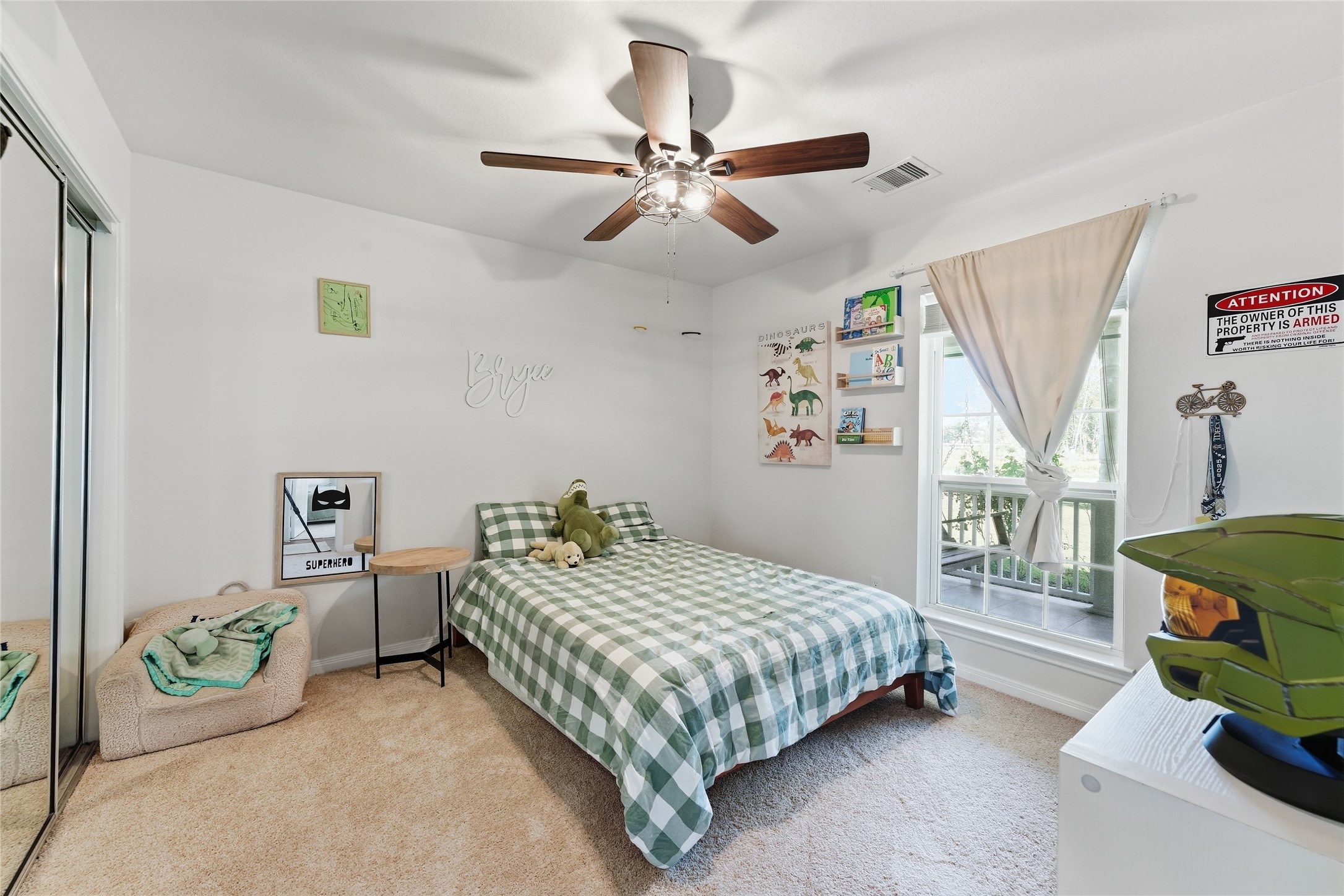 This secondary bedroom offers plenty of natural light and new carpet.