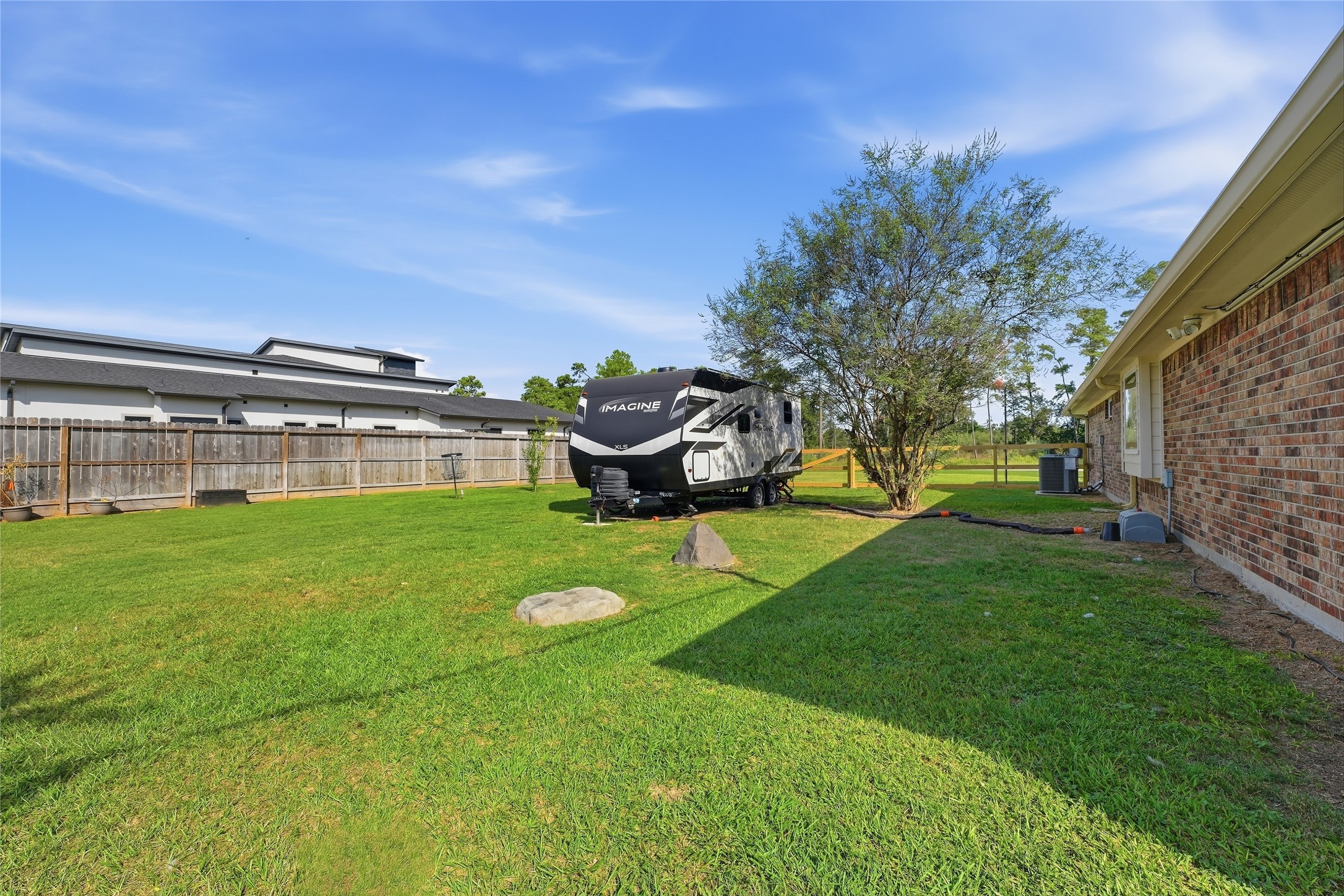 Keep your RV at home with extra parking space, two RV hookups and a generator hookup.