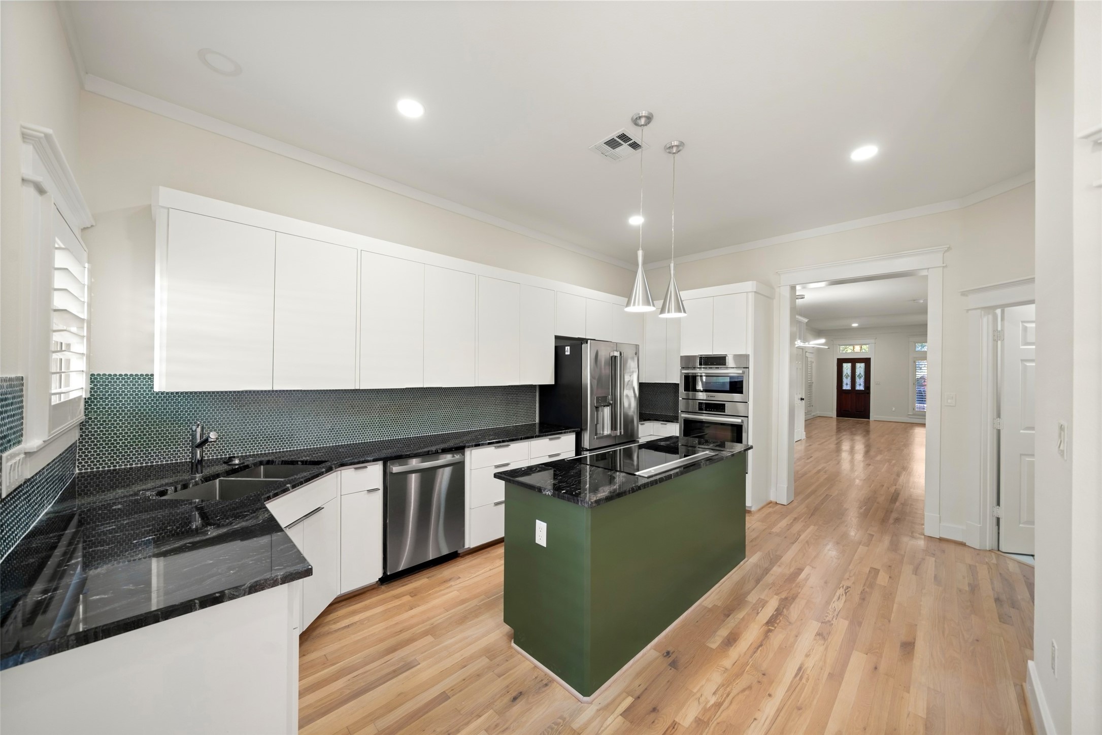A designer-accented island creates a stunning centerpiece for cooking, gathering, and entertaining.