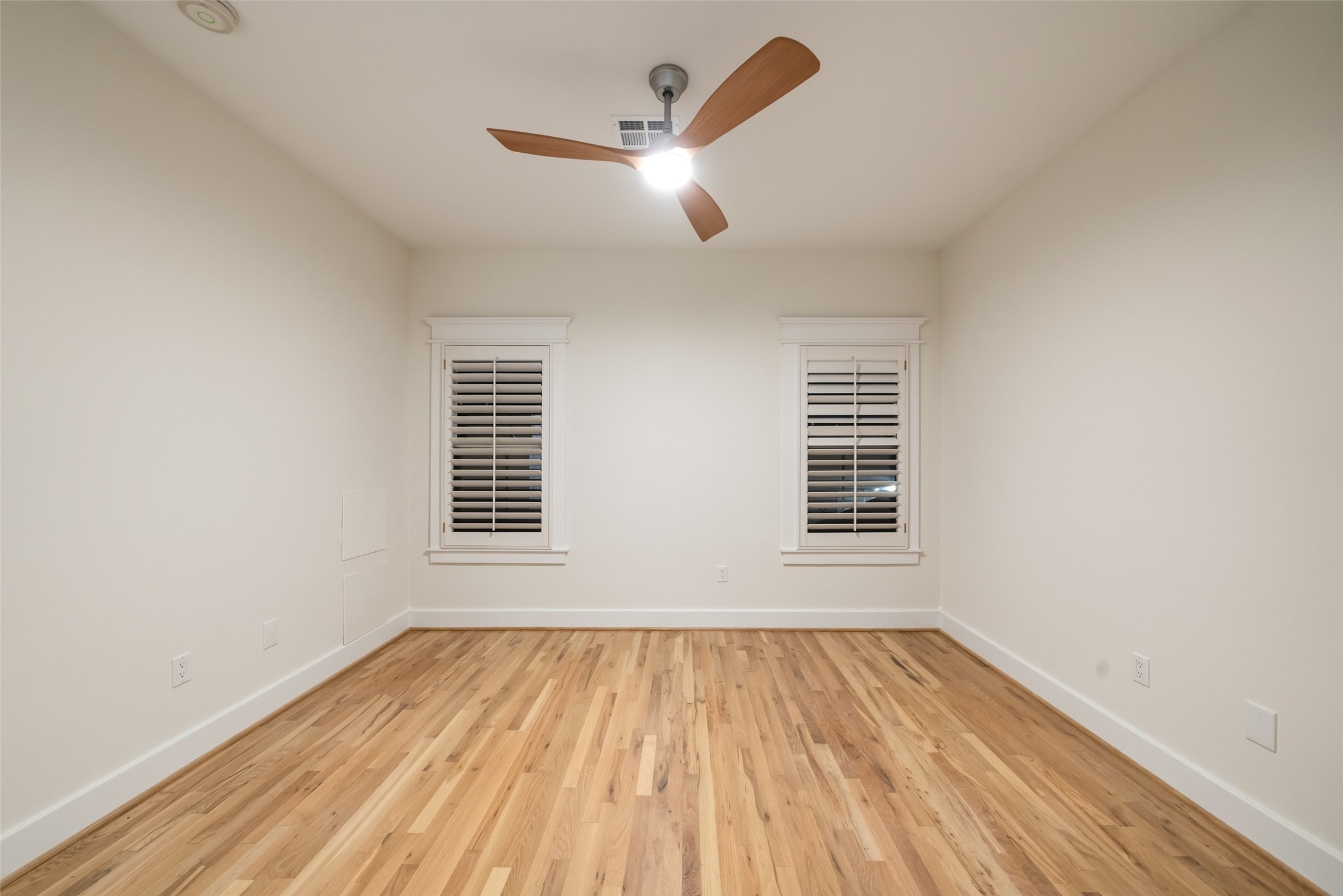 An inviting secondary bedroom offering flexibility for guests, work, or hobbies.