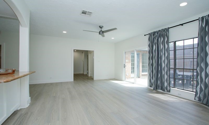 huge family room open to kitchen breakfast area and outside patio