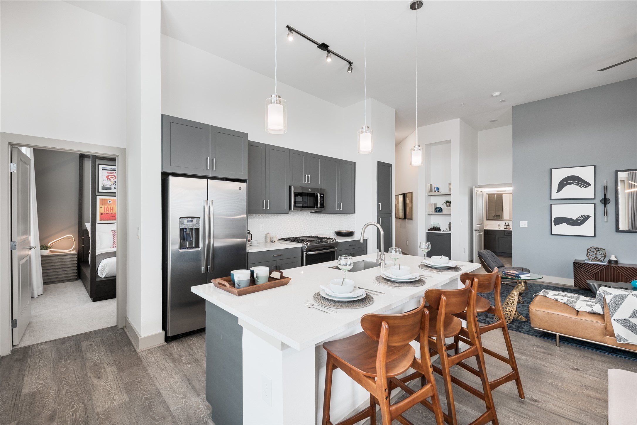 The kitchen is truly the heart of this home. A generous quartz island invites morning coffee, casual meals and conversations that linger. Sleek cabinetry, stainless steel appliances and elegant pendant lighting make everyday living feel a little more special. *Pictures are from a similar unit, finishes and distribution may change.