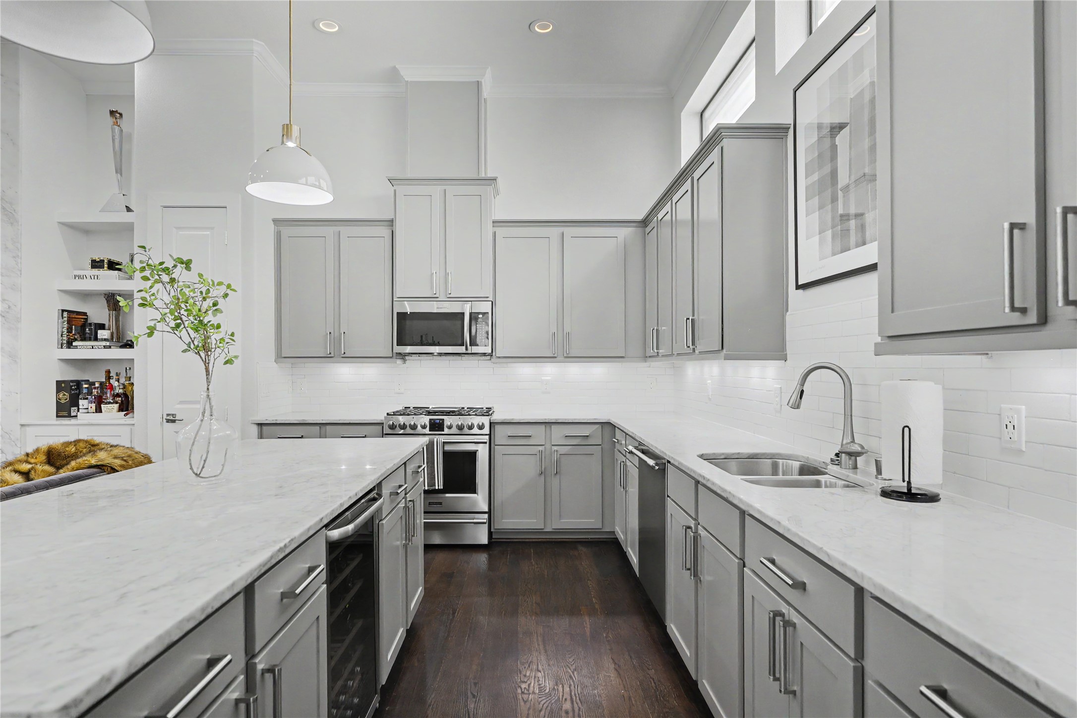 Wine fridge included along with the stainless steel refrigerator in this gourmet kitchen.
