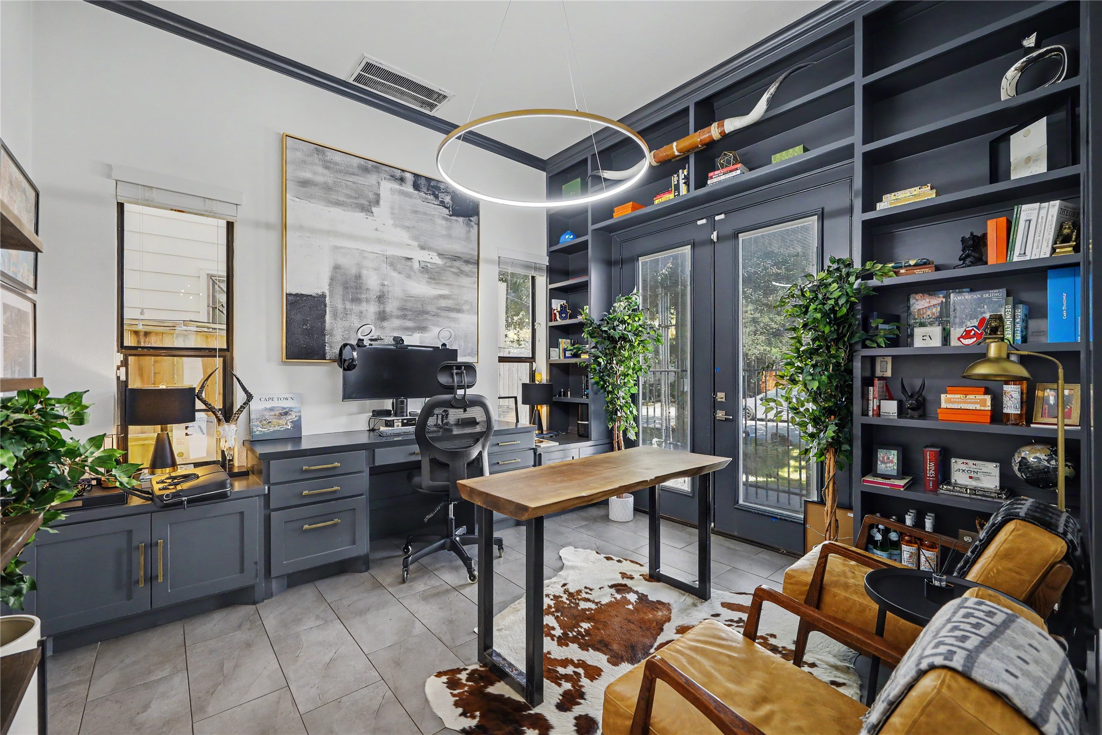 Custom built-in bookshelves and desk in this first-floor bedroom. This bedroom can still fit a bed to make it an actual bedroom as well. Custom built-in bookshelves and desk in this first-floor bedroom. This bedroom can still fit a bed to make it an actual bedroom as well.