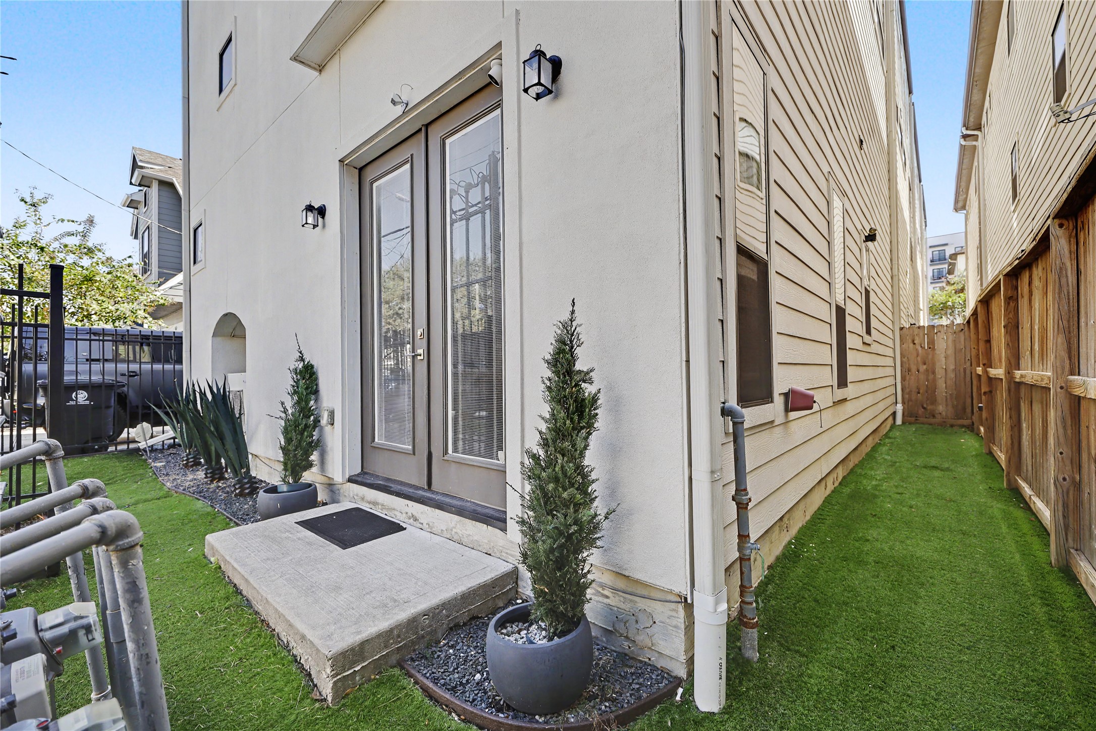 View of the side yard and backyard. A true lock and leave lifestyle.