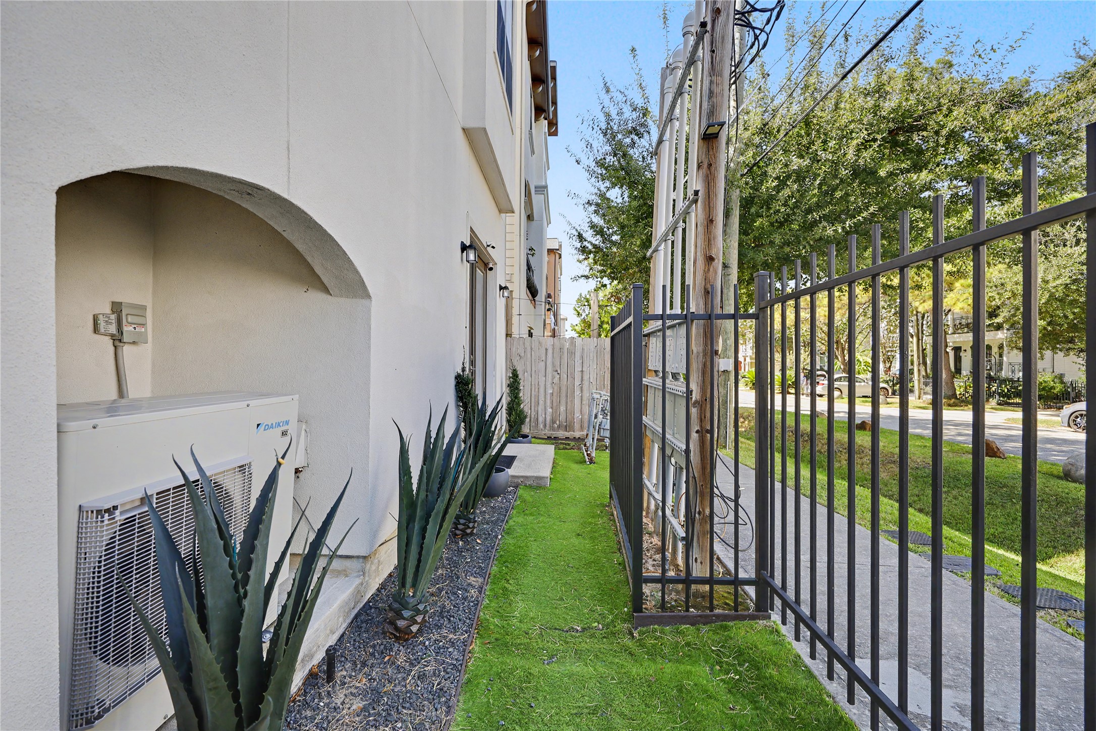 A look at the fenced in yard with turf for zero maintenance.