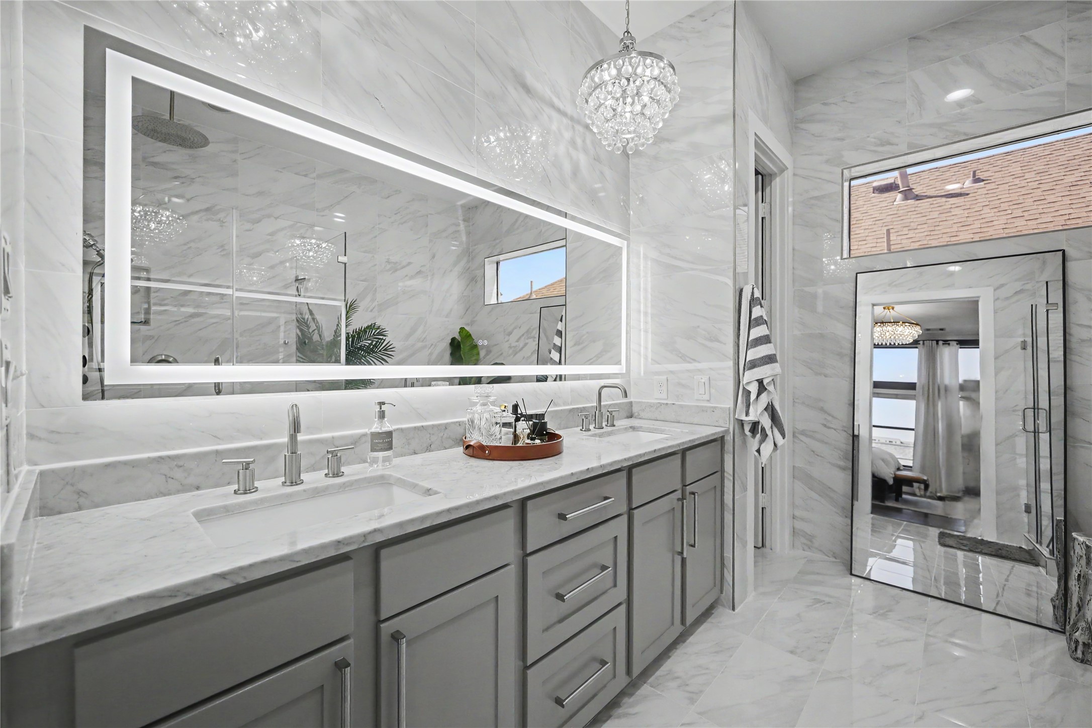 Wall-to-wall mirror with ample counter space.