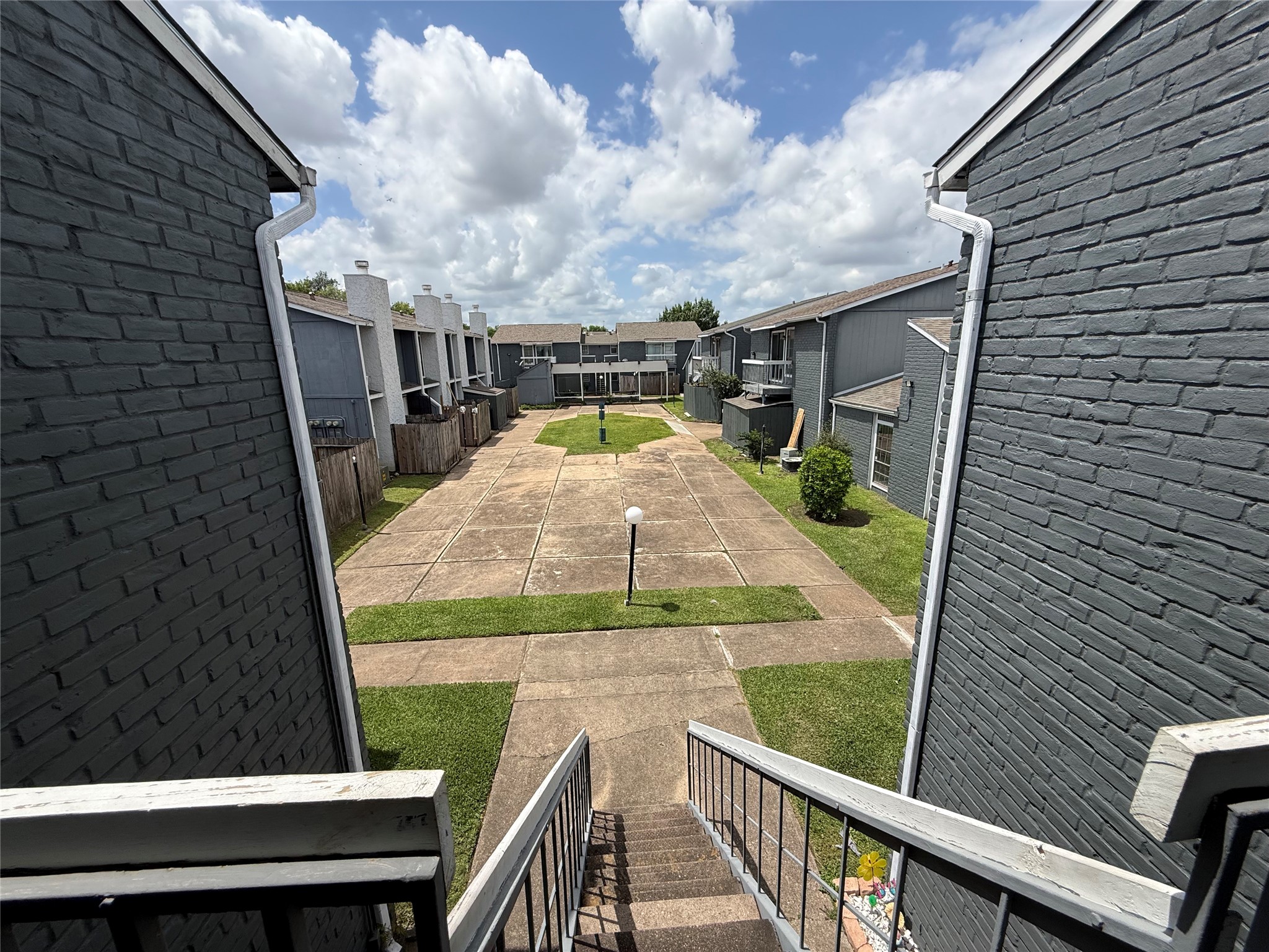 Front entry and stairs lead directly into community courtyard.