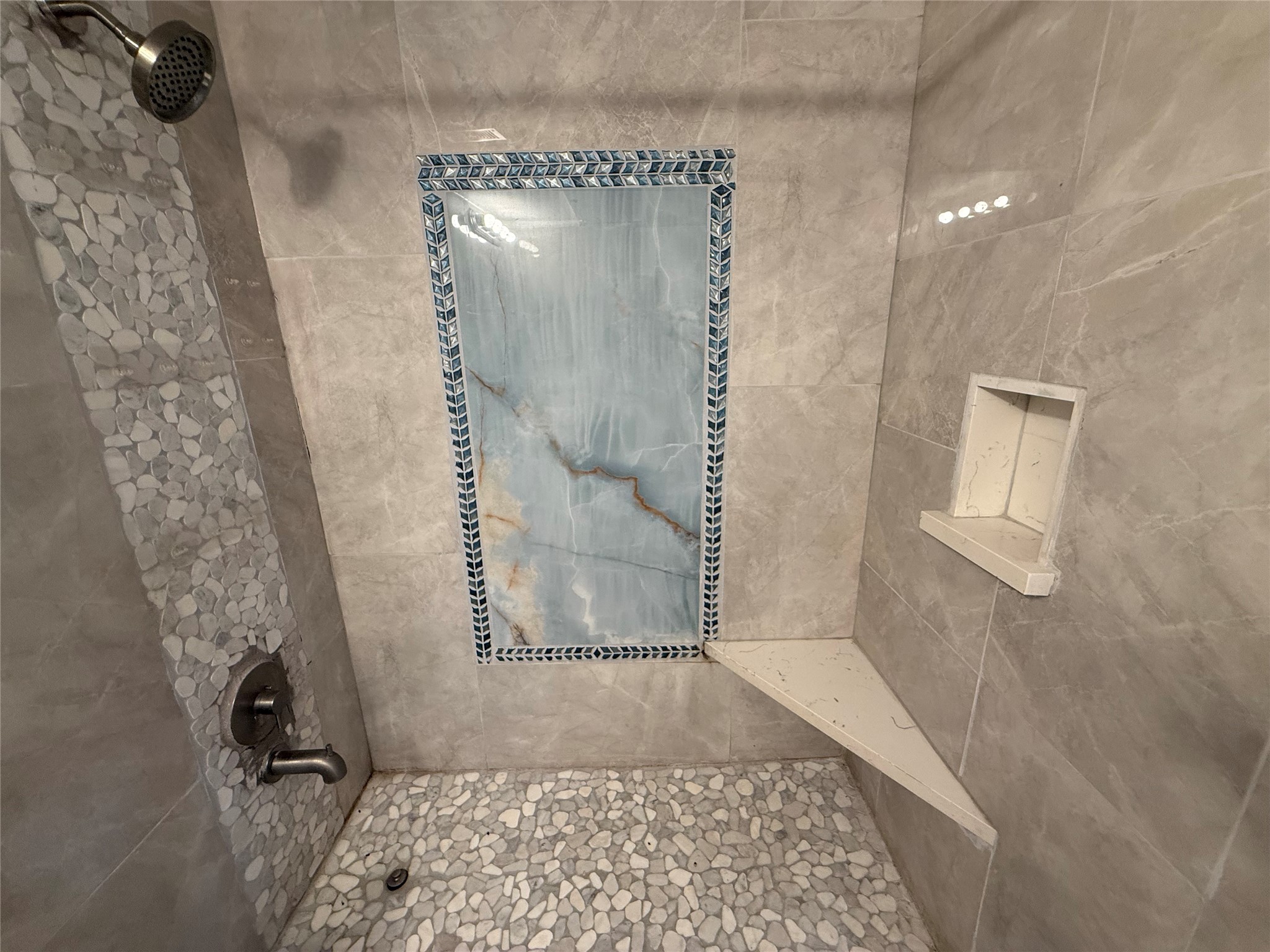 Beautiful tilework in the shower. Beautiful tilework in the shower.