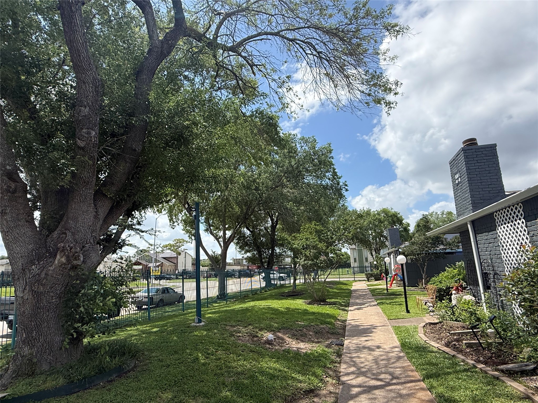 Huge trees provide shade from the Texas heat when you take a walk inside the gated complex.