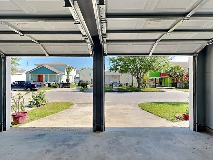 Garage opens to the double-wide driveway