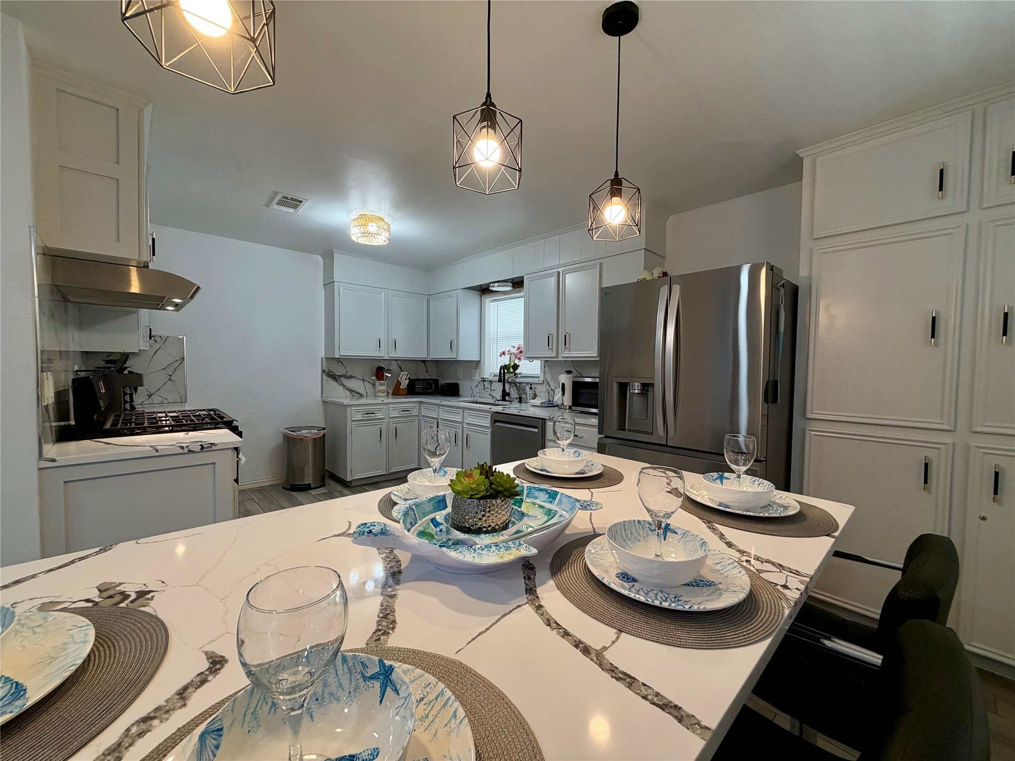Dinner is served! Eat-in kitchen with built in dining area with abundant storage.
