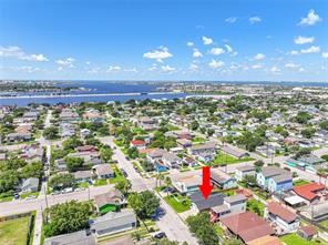 Aerial view towards the W; Offatts Bayou and 61st Street can be seen here
