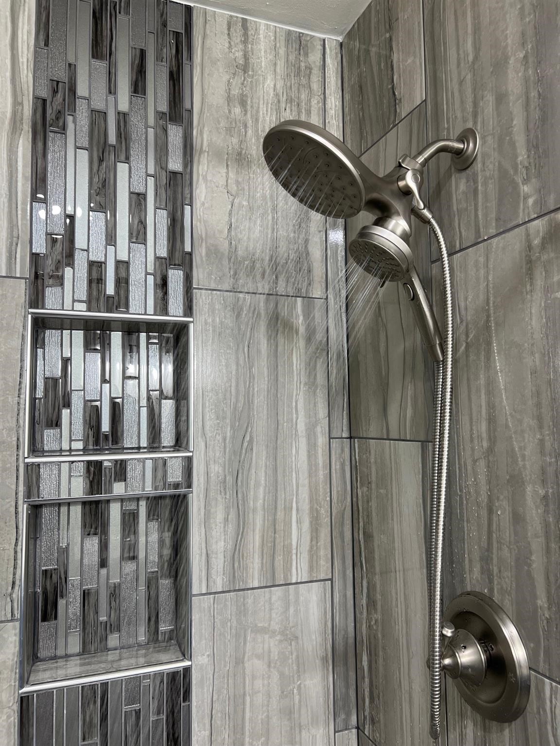 Note the attention to detail in the custom-tiled shower