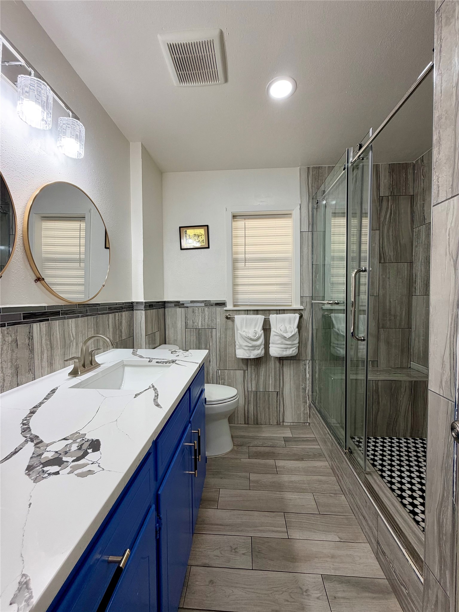Lovely guest bathroom with custom tiled shower