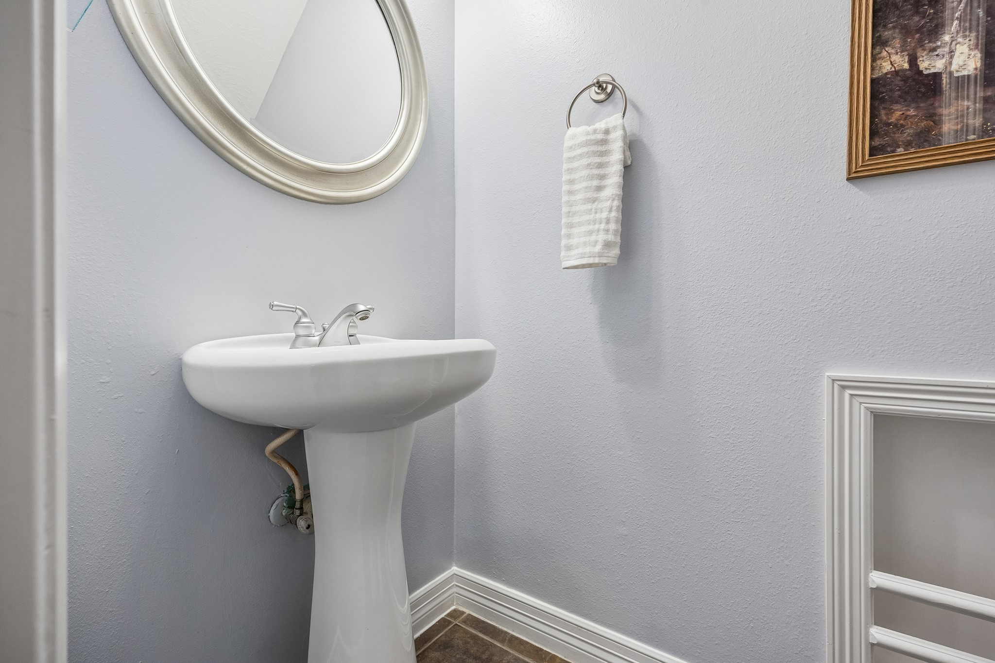 A conveniently located powder room, perfect for guests when entertaining.