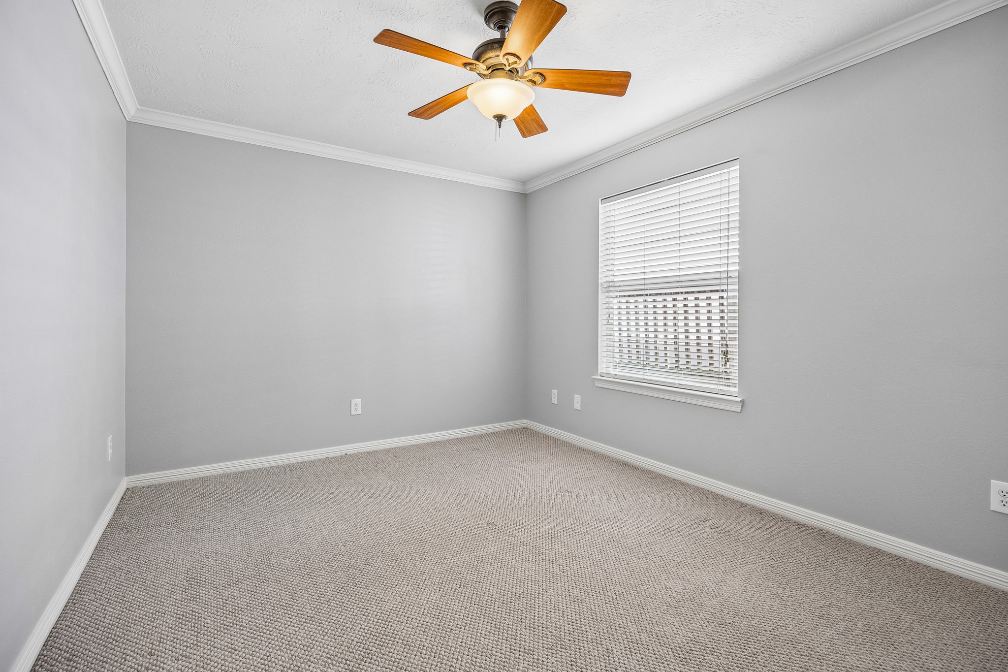 A versatile room ready to become a comfortable bedroom, home office, or creative space.