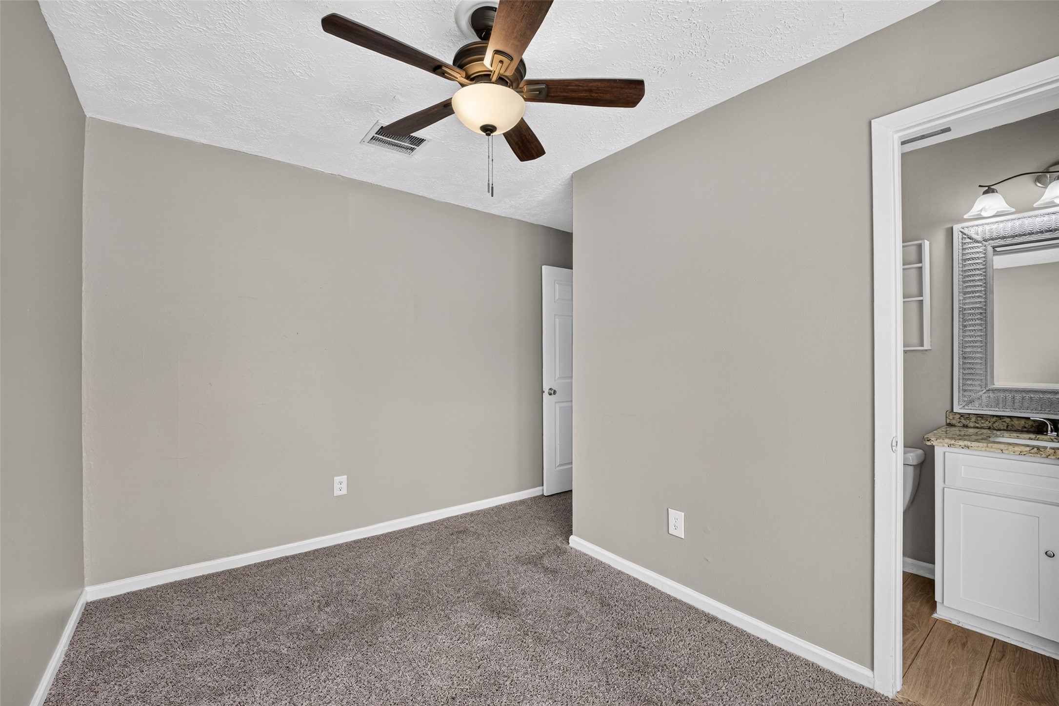 Another view of bedroom three facing the front of the house